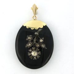 pendant / medallion of onyx and silver flower with rose cut diamond 14k gold