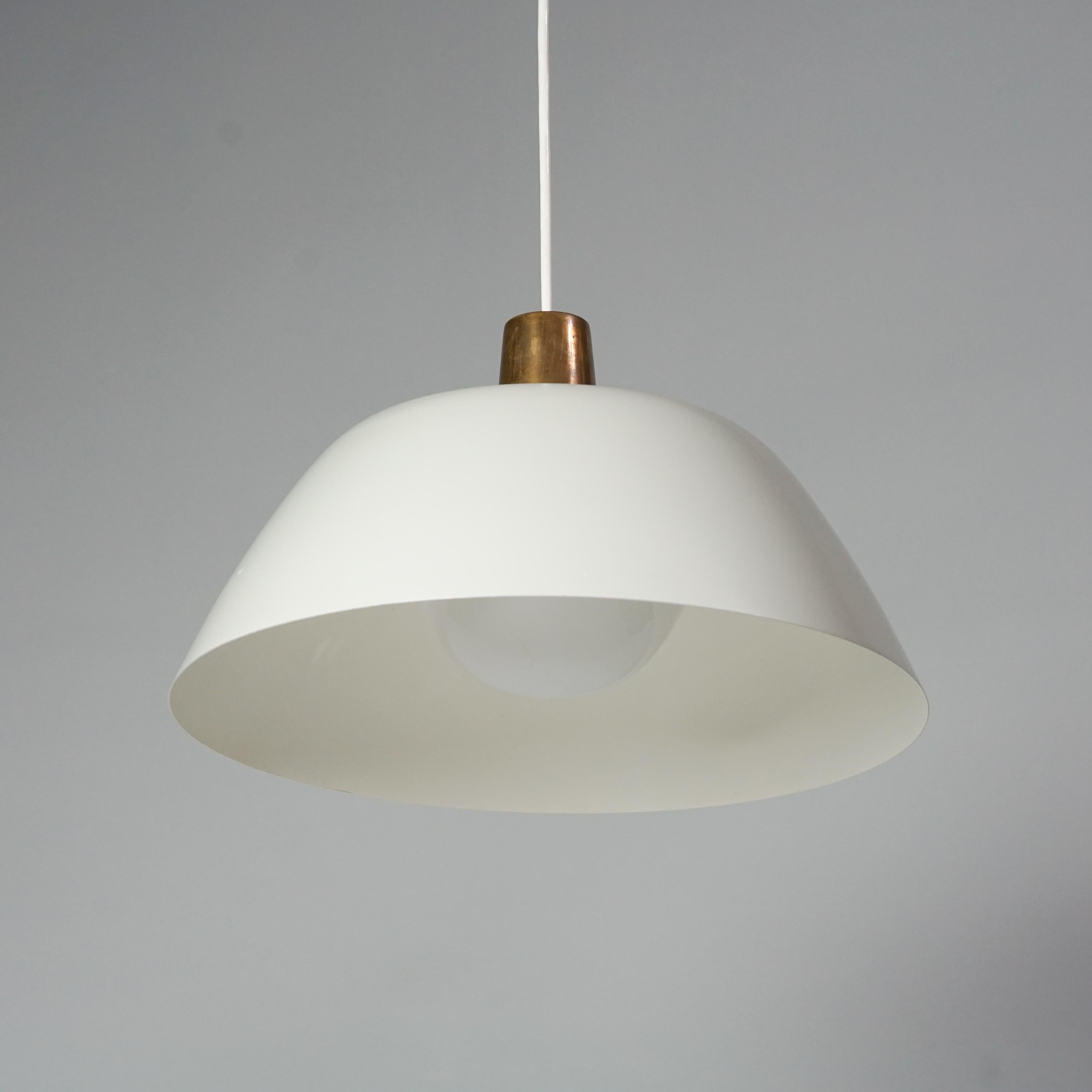 Pendant Model 61-376, designed by Lisa Johansson-Pape, 1950/1960s. Brass details, painted metal  and acrylic lampshade. Marked. Good vintage condition, minor patina consistent with age and use. Adjustable height. 

Lisa Johansson-Pape is one of the