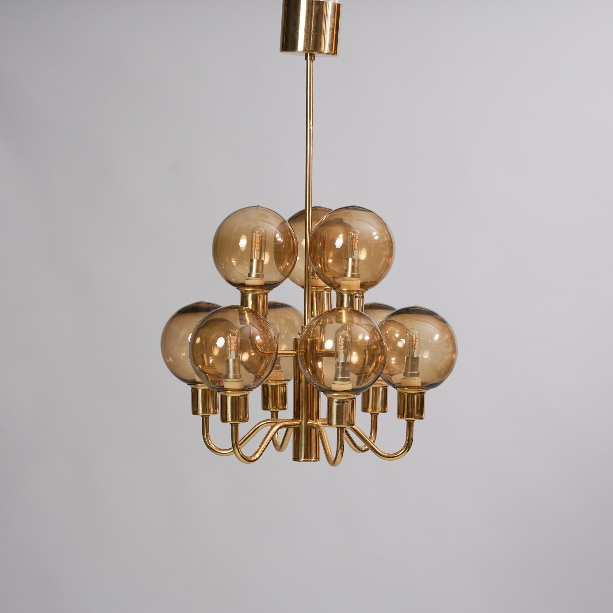 Pendant model T-716 designed by Hans-Agne Jacobsson for Markaryd from the Late 20th Century. Brass with glass shades. Good vintage condition, minor patina consistent with age and use.

Hans-Agne Jakobsson (1919-2009) was a Swedish furniture and