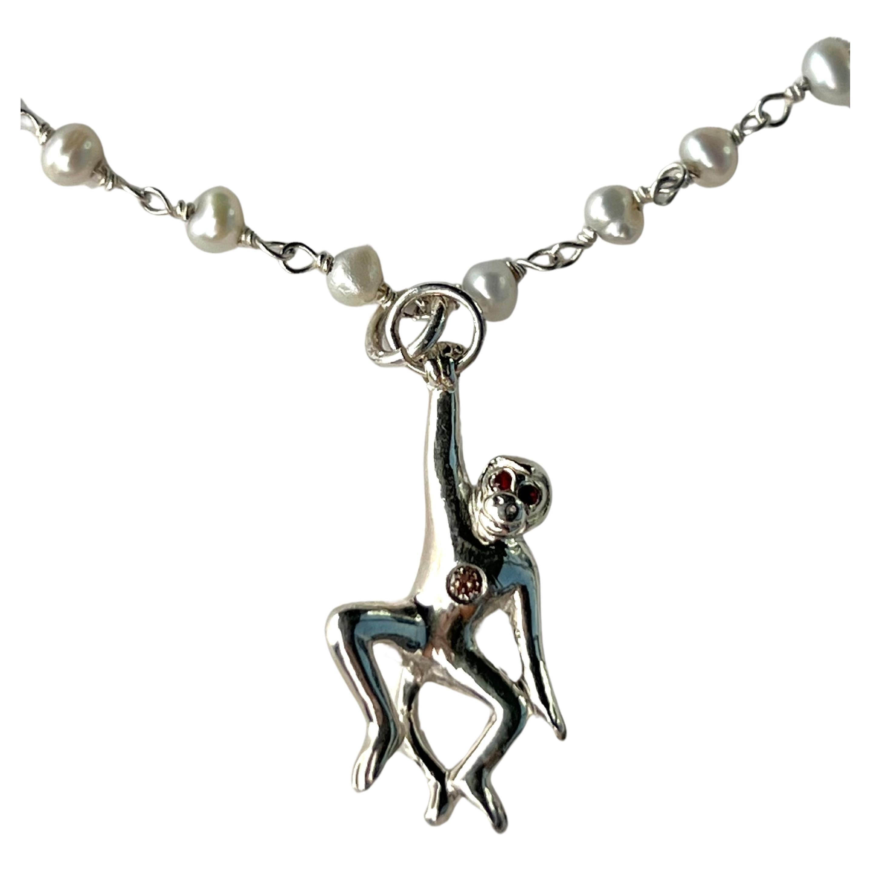 Diamond Tummy Ruby Eyes Pendant Monkey on a Silver Pearl Rosario Chain Necklace 

Hand made in Los Angeles

Made to order 2-4 weeks to be completed

28