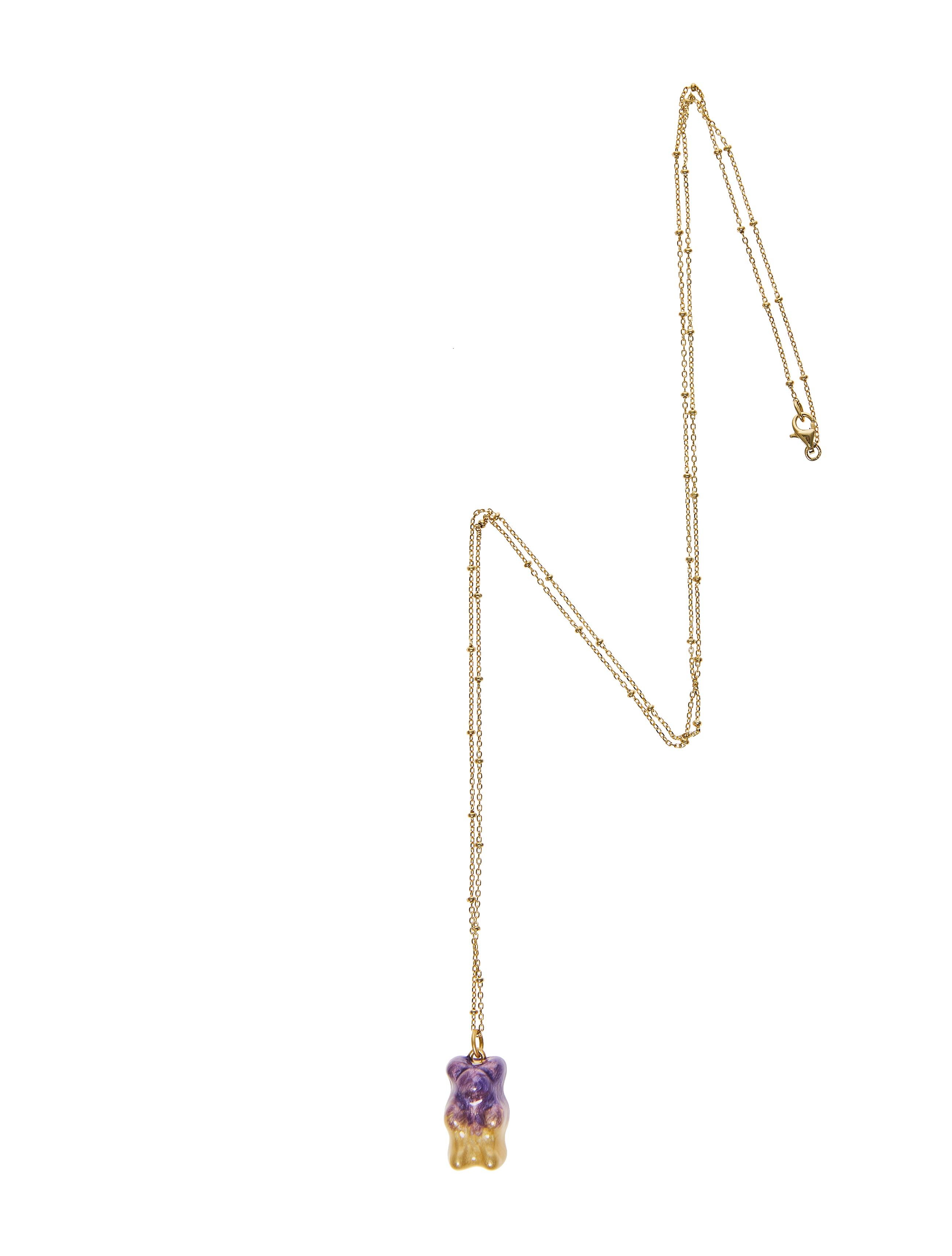 18K gold plated silver gummy bear pendant on silver gold plated chain with transparent purple and yellow   enamel coverage. 

The Gummy Project by Maggoosh is a capsule collection inspired by the designer's life in New York City and her passion for