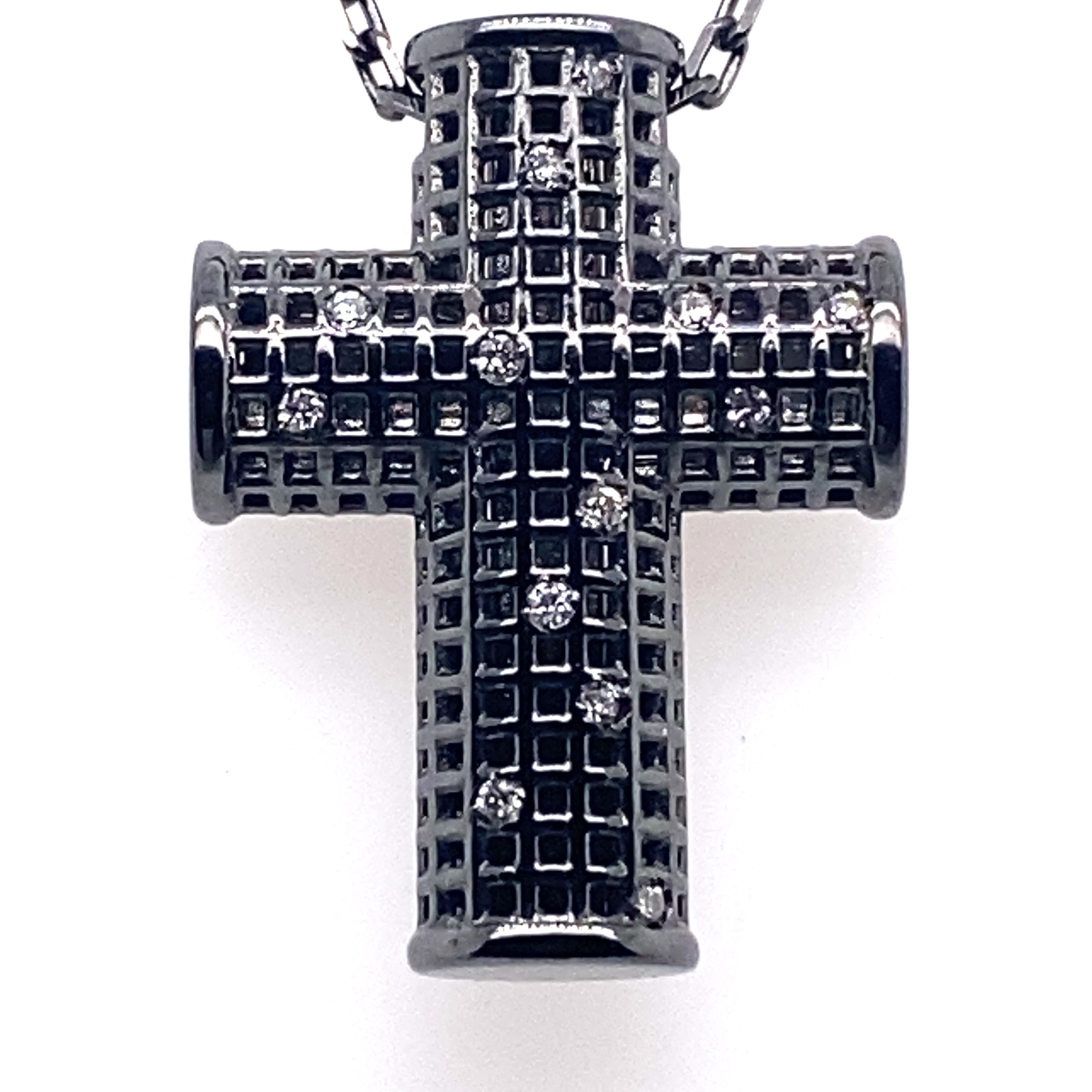 This magnificent cross pendant necklace embodies timeless elegance and modern sophistication. Crafted in black rhodium-plated 18-carat white gold, this exceptional piece of jewellery reflects both light and boldness.

The cross, a universal symbol