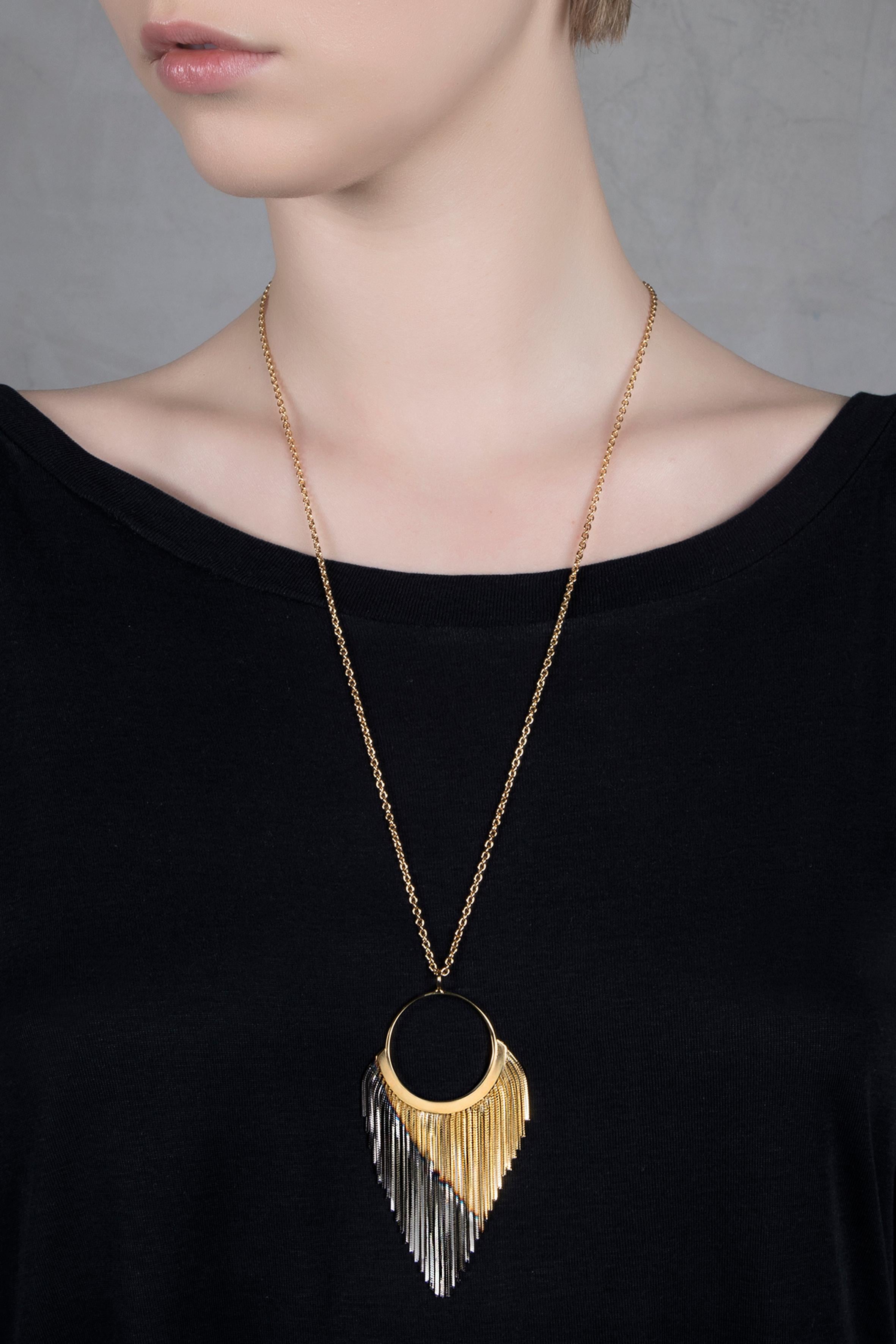 Referencing Iosselliani’s signature craftsmanship, this necklace features a two tones finishing hoop pendant, combining the 18 carat gold plating with a darker shade of gunmetal. Designed in Italy since 1997 the piece shows the iconic two tones