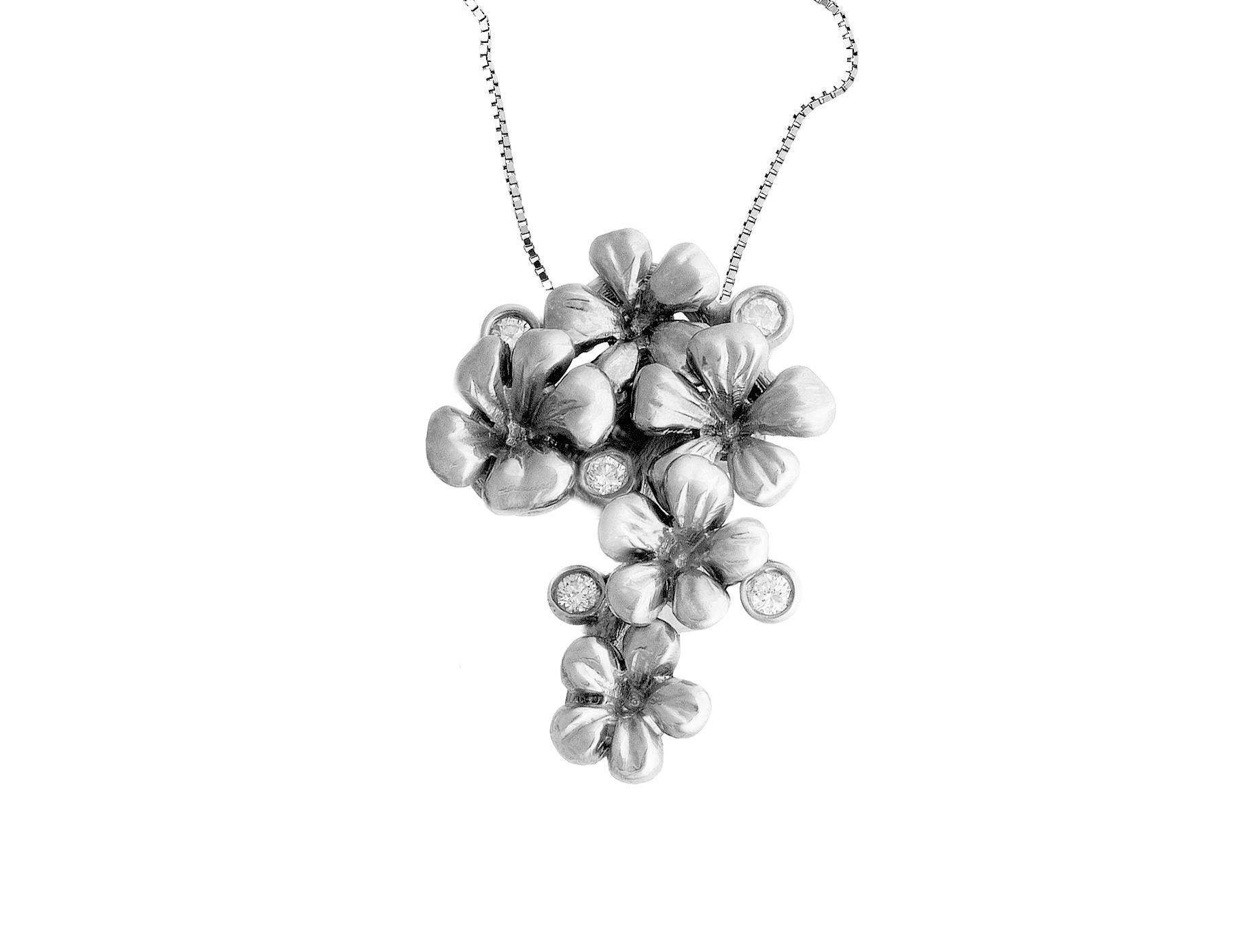 This contemporary 18 karat white gold pendant necklace is encrusted with 5 round diamonds and detachable natural emerald, 1.9 carats, 0.33x0.26 inches. This jewellery collection was featured in Vogue UA review.
The size of the piece is 1.45x0.67