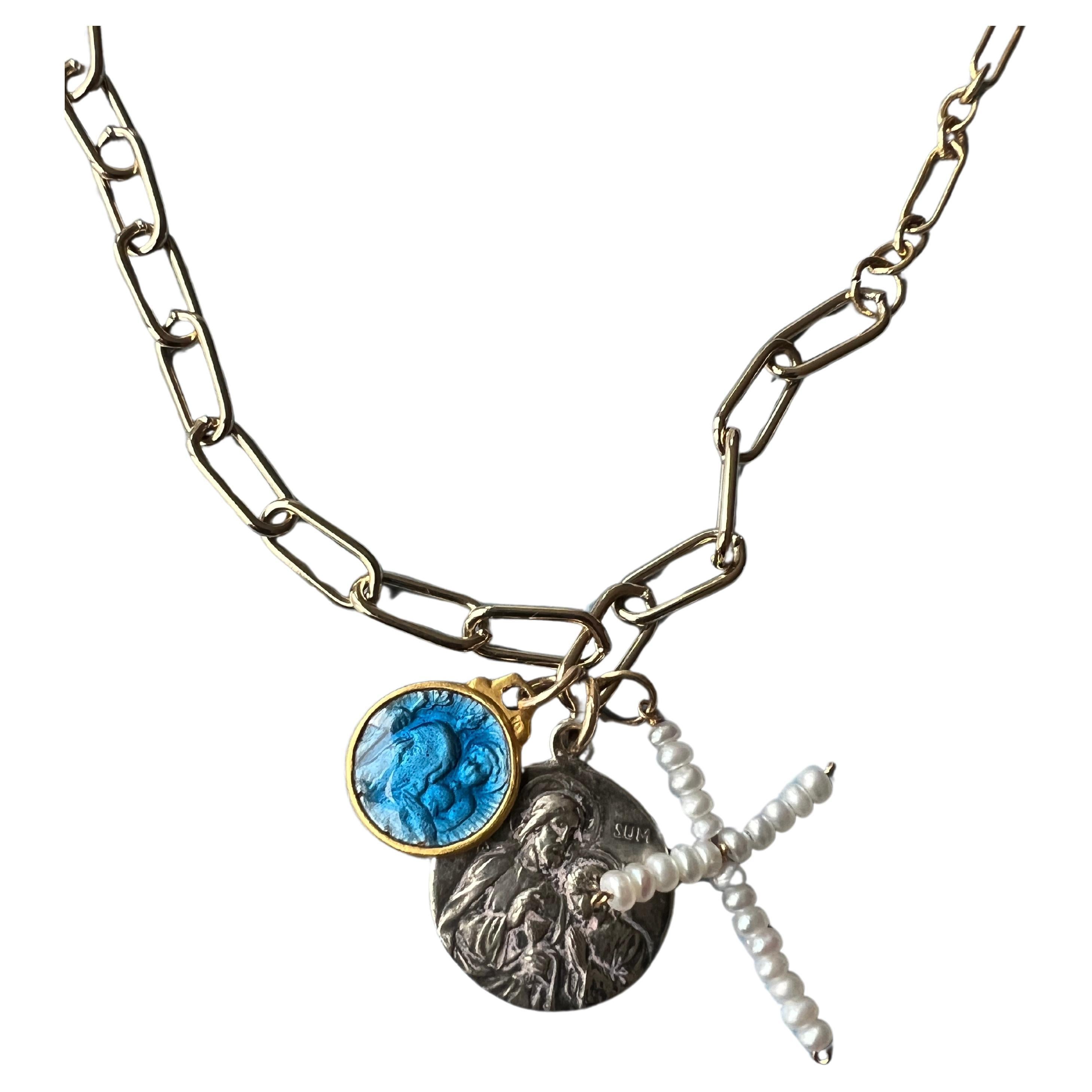 Silver toned Vintage or Antique Jesus Medal with a 
Cup at the  Last Supper and a second medal with Blue Enamel and possibly the protector Joseph with a staff and Virgin Mary in the background, together with the third pendant that is a White Pearl