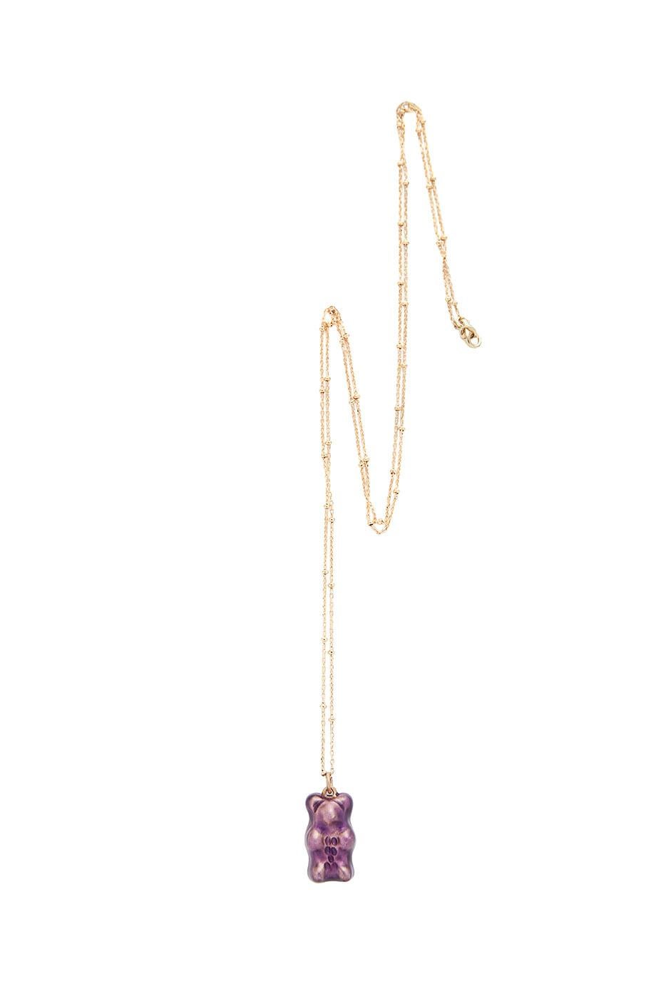 Grape  Gummy bear 


18K gold plated silver gummy bear pendant on silver gold plated chain with transparent purple enamel coverage. 

The Gummy Project by Maggoosh is a capsule collection inspired by the designer's life in New York City and her