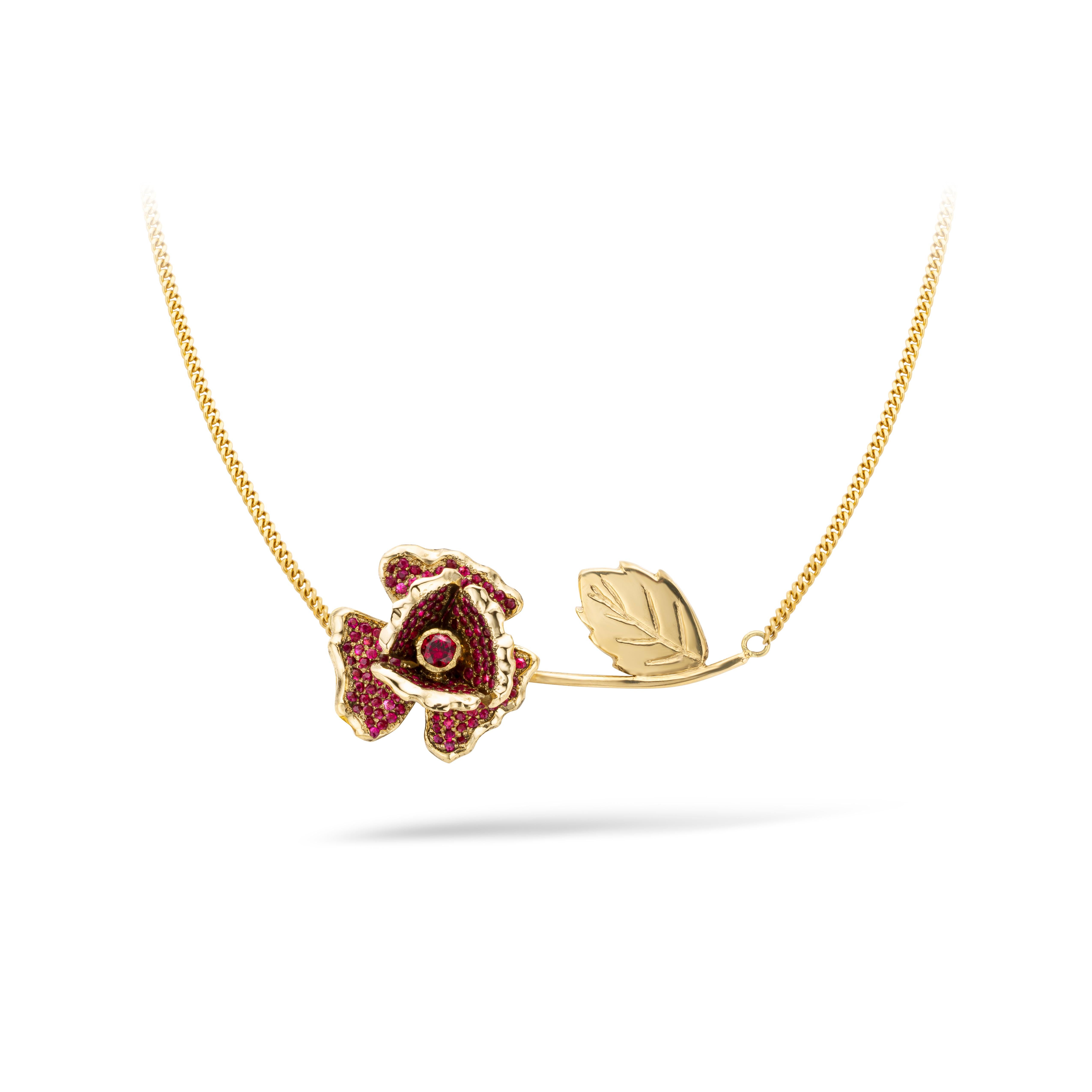 [specs below...]

18 karat gold necklace with rose

Why give roses that will  wither? Why not give one rose that will shine forever! This special gold rose is the best present for your love!  The gold flower is set with aproximately 150 deep red