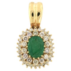 Pendant set with emerald and diamonds 14k yellow gold