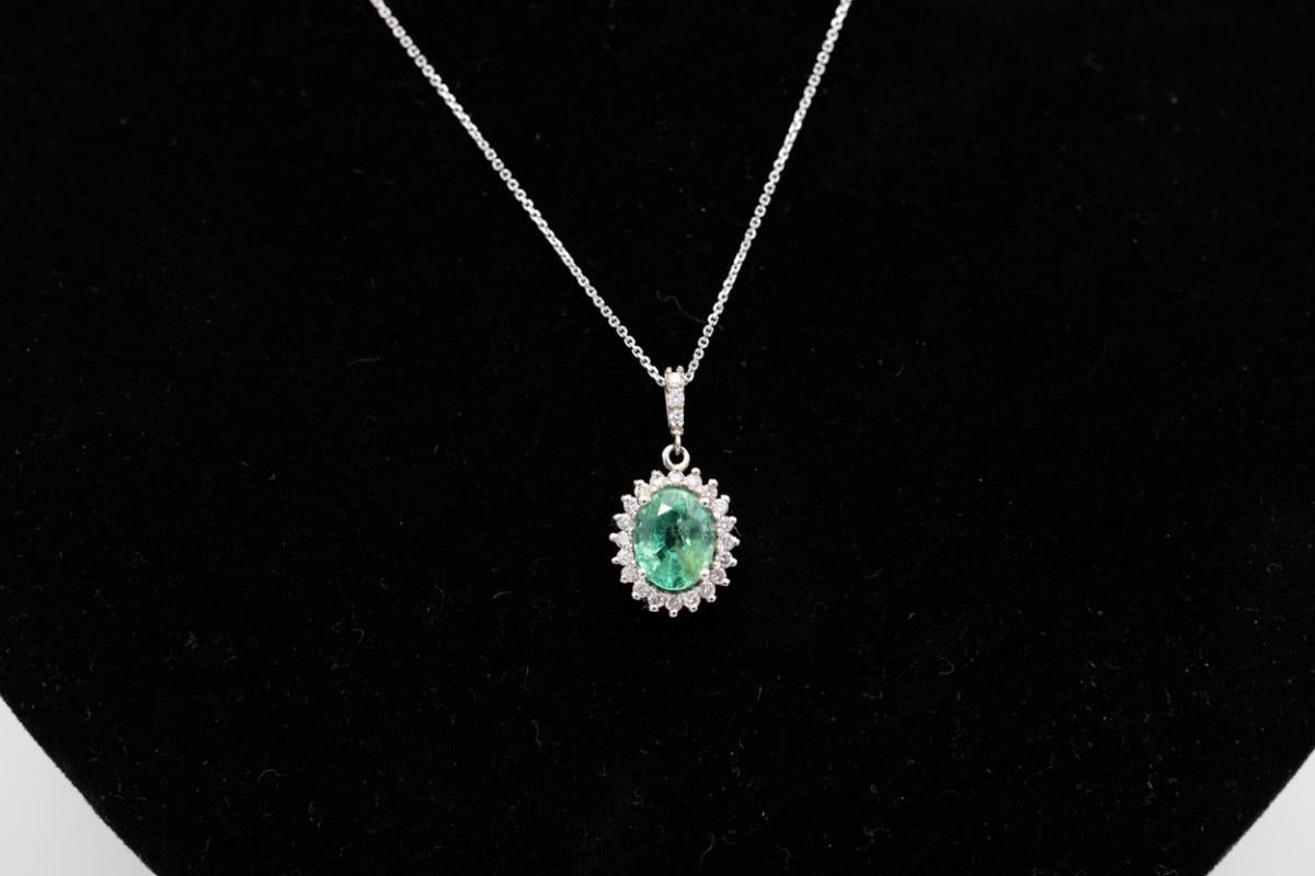 An unusual vintage pendant made of 0.585 white gold

Decorated with a beautiful transparent natural emerald weighing 1.82ct and 23 pink brilliant-cut diamonds weighing 0.34ct (diamond clarity VS1-SI3)

Item weight: 2.78g

Dimensions: 2x1cm

Very