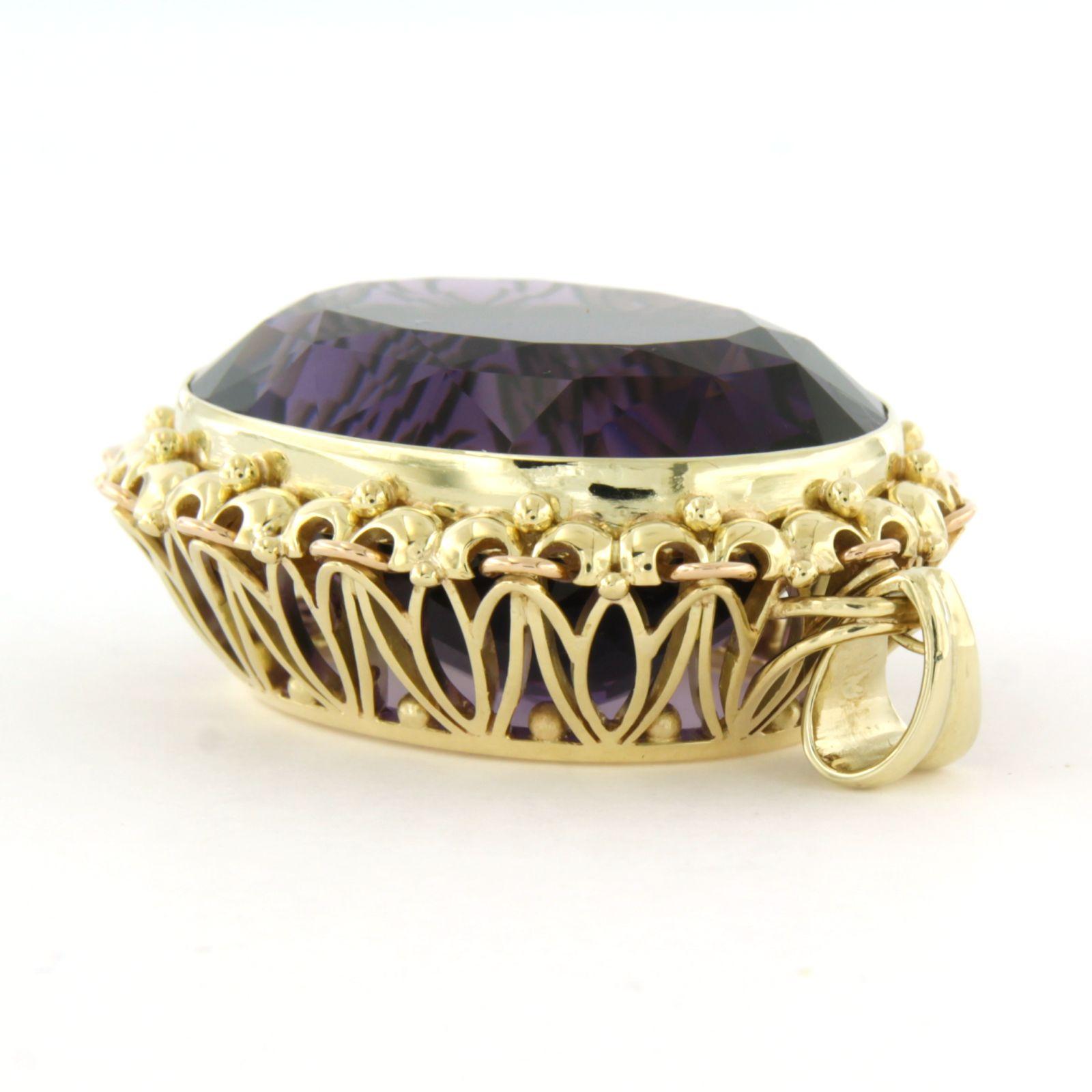 14k yellow gold pendant set with an amethyst total approximately 54.00ct - 31.1 grams

Detailed description

dimensions of the pendant are 4.8 cm high by 3.3 cm wide

total weight: 31.1 grams

set with:

- 1 x 3.2 cm x 2.5 cm oval facet cut amethyst