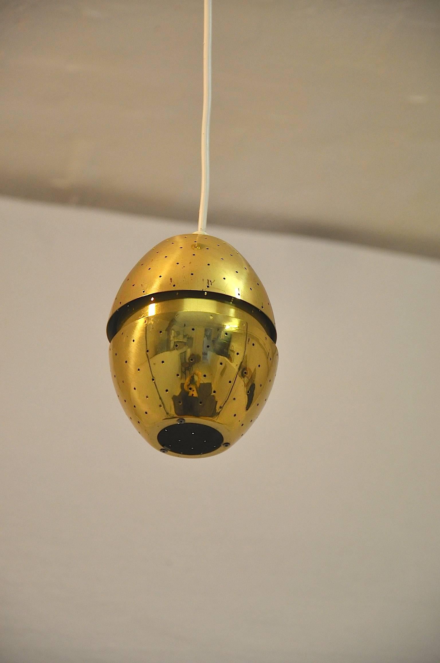 Brass perfotated pendants by Hans Agne Jakobsson.