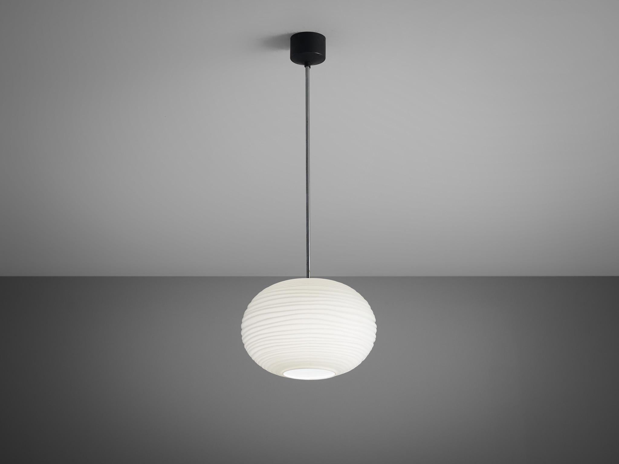 Pendants, glass, metal, Europe, 1970s

Very elegant ceiling lamps with large matte white shades defined by organically rippled surfaces. The lamp radiates an ambient light partition. The lamp is closed to the ceiling with a black lacquered mounting.