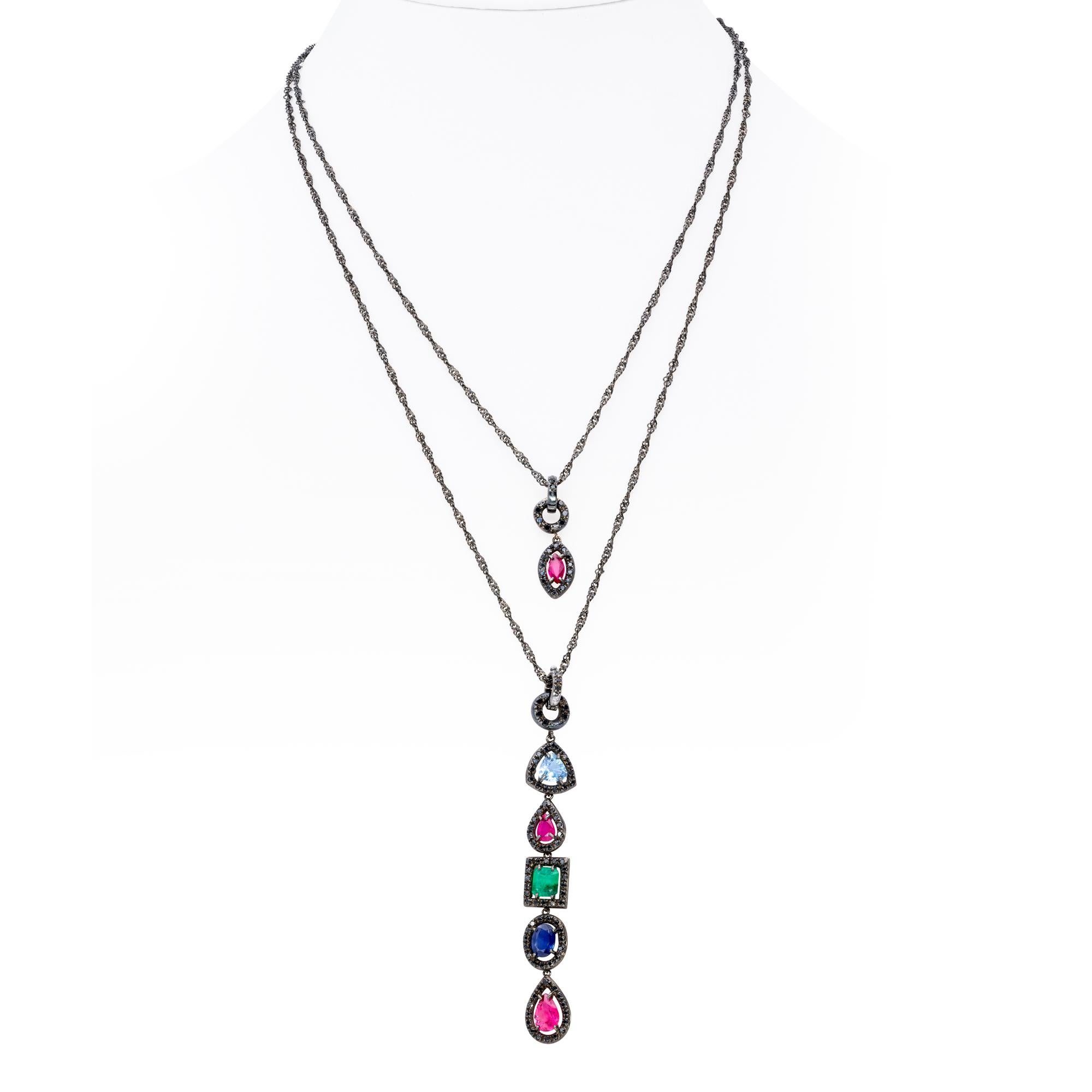 A Pair of Pendants in Precious Stones and Black Diamonds set on 18 kt gold from d'Avossa Rainbow Collection
Those two asimmetric Pendants are made with Rubies, Emerald, Sapphires and Aquamarine in different cuts set with a frame of Black