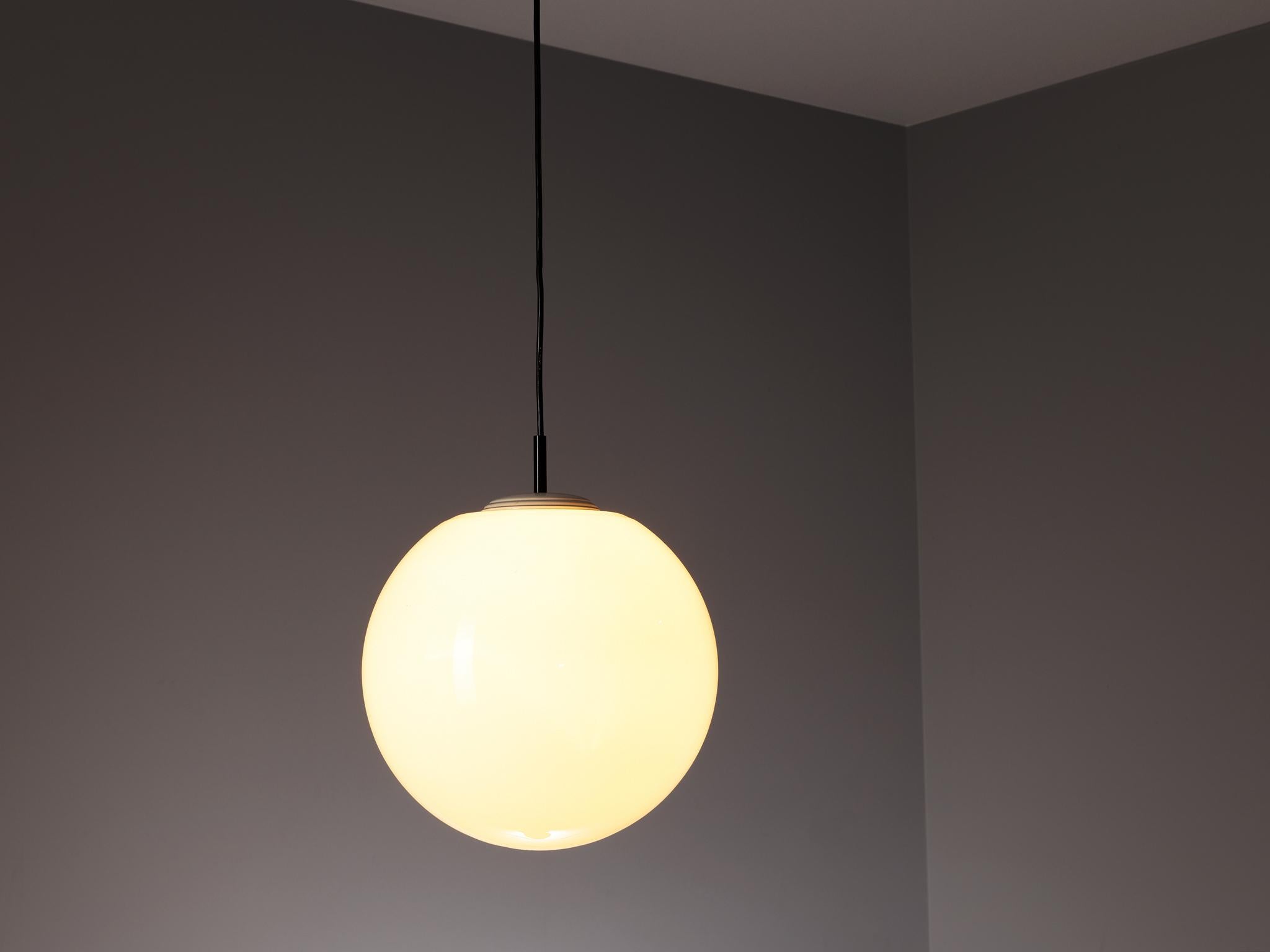 Pendants, glass, metal, Europe, 1960s

A milk glass pendant with contrasting black wiring that creates a convivial and easy feel. The opaque glass sphere creates a beautiful and warm diffused light. Kindly note that we have five available, this