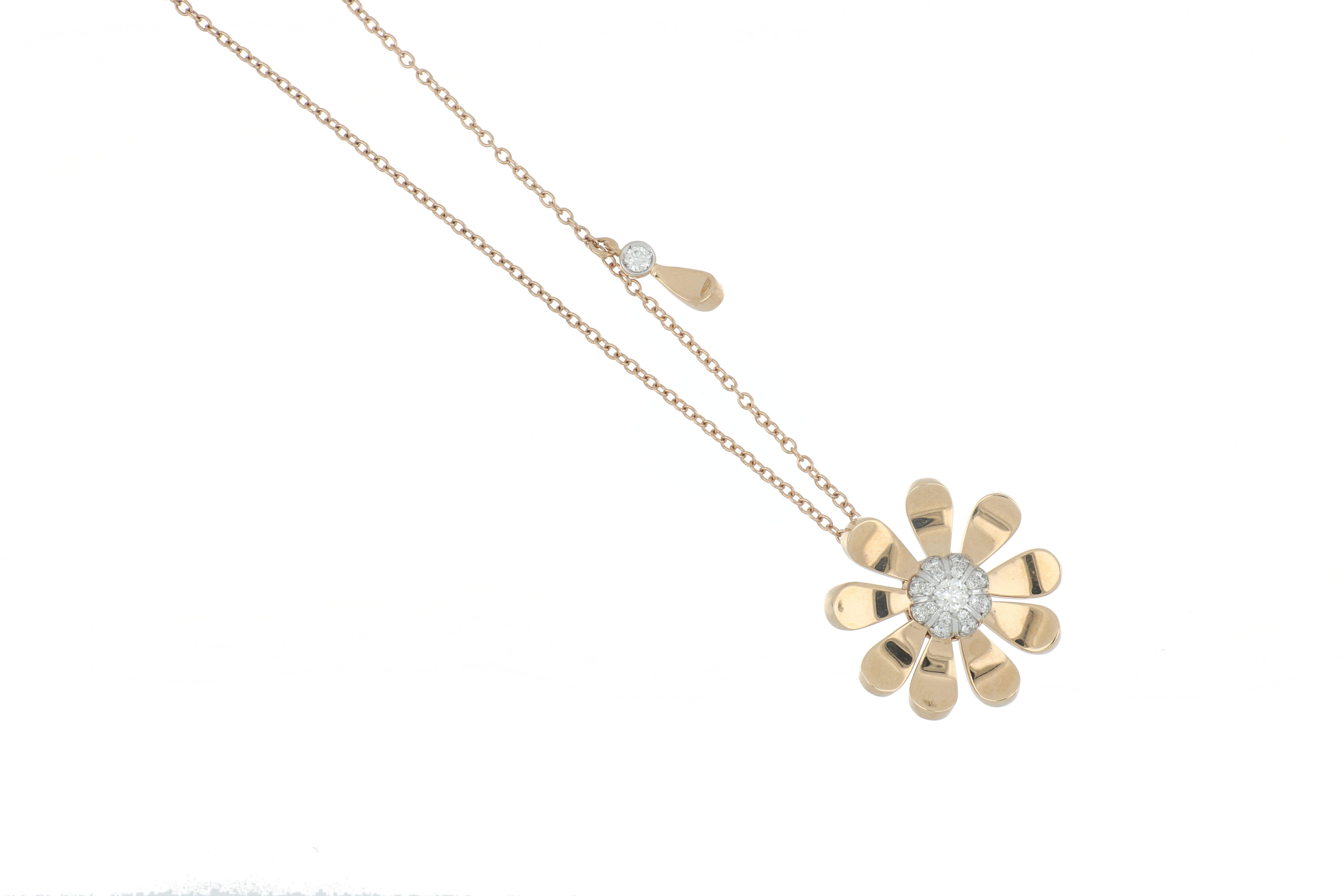 This gorgeous and delicate pendant was inspired by daisies and their simple and classic design. Exuding innocence, purity, and beauty this pendant captivates the charm and radiance of a daisy. This pendant has moveable parts and it is 18k rose gold