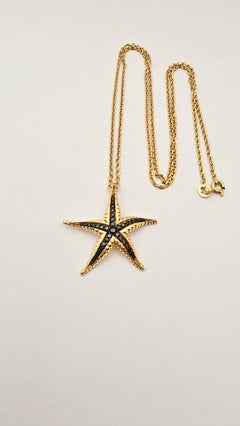 Pendentif étoile de mer en or jaune et diamants noirs