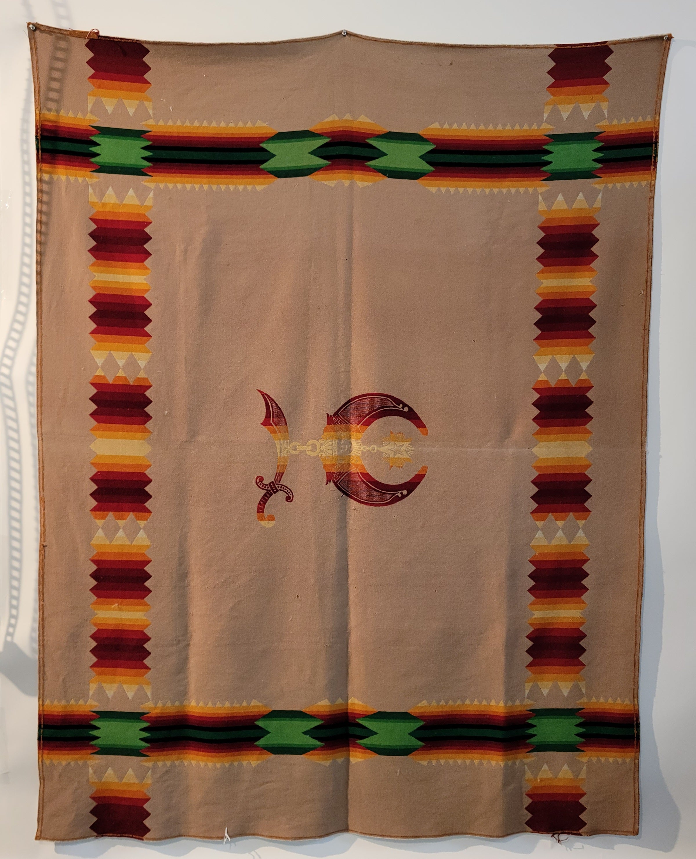 Pendleton Indian Design camp blanket with a masonic symbol in the center of the blanket.