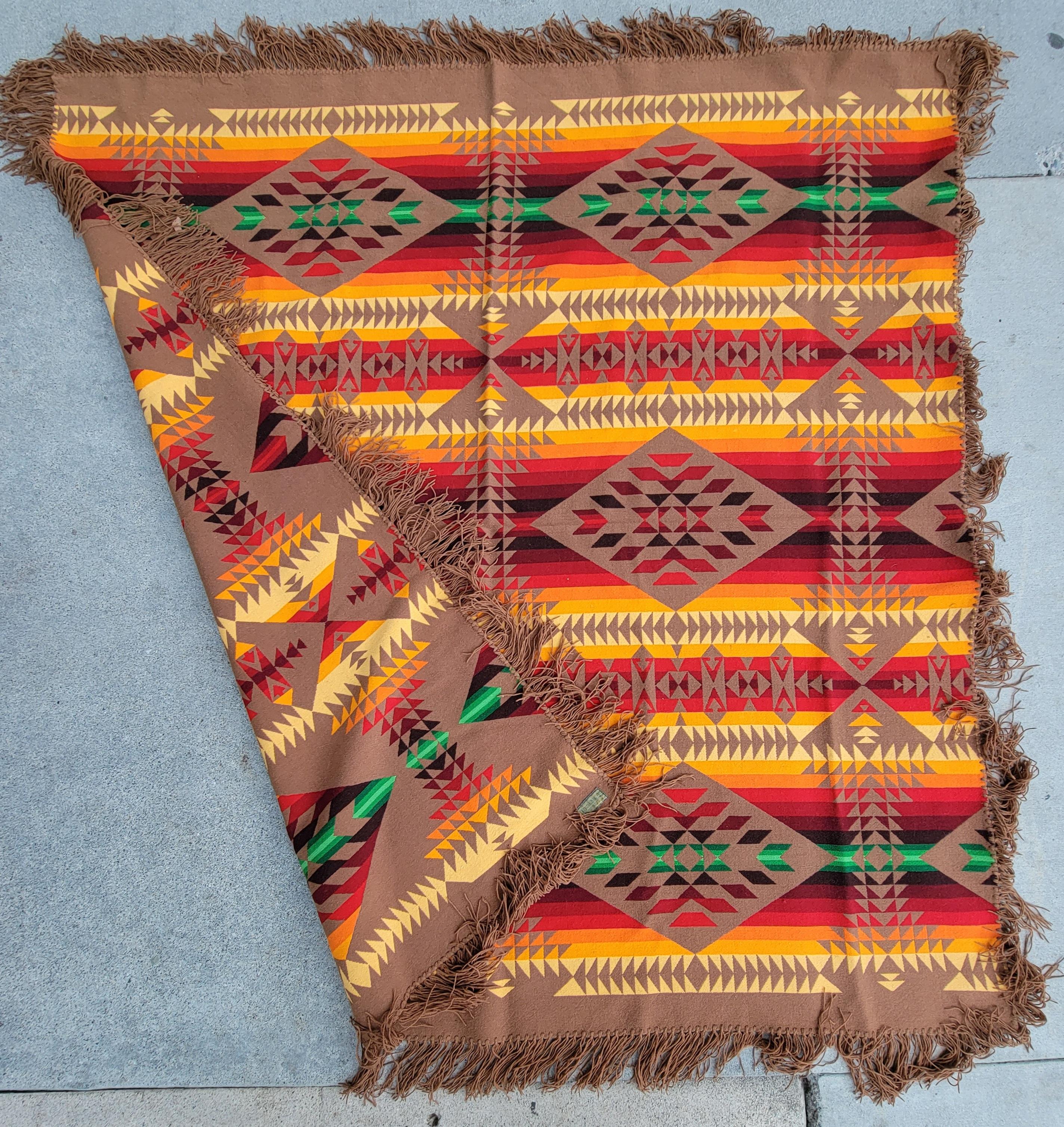 This fantastic Pendleton / Cayuse fringed Indian design camp blanket has the original label and in great condition.