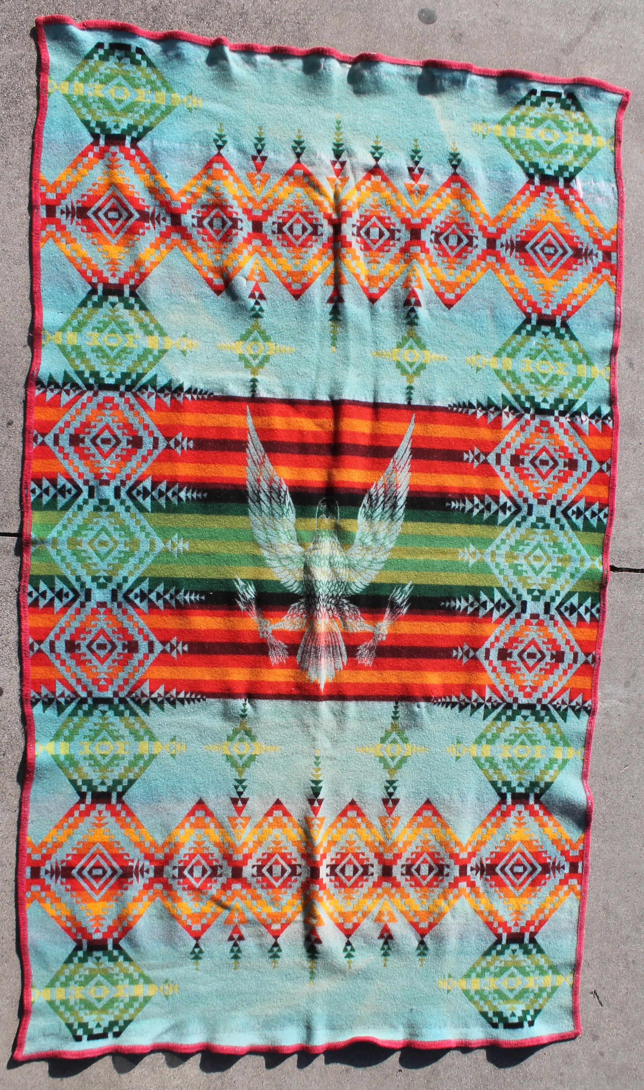 This mid-20th century blanket has a eagle pattern on both front and back of blanket. This blanket has wear but is really quite rare and unusual to find.