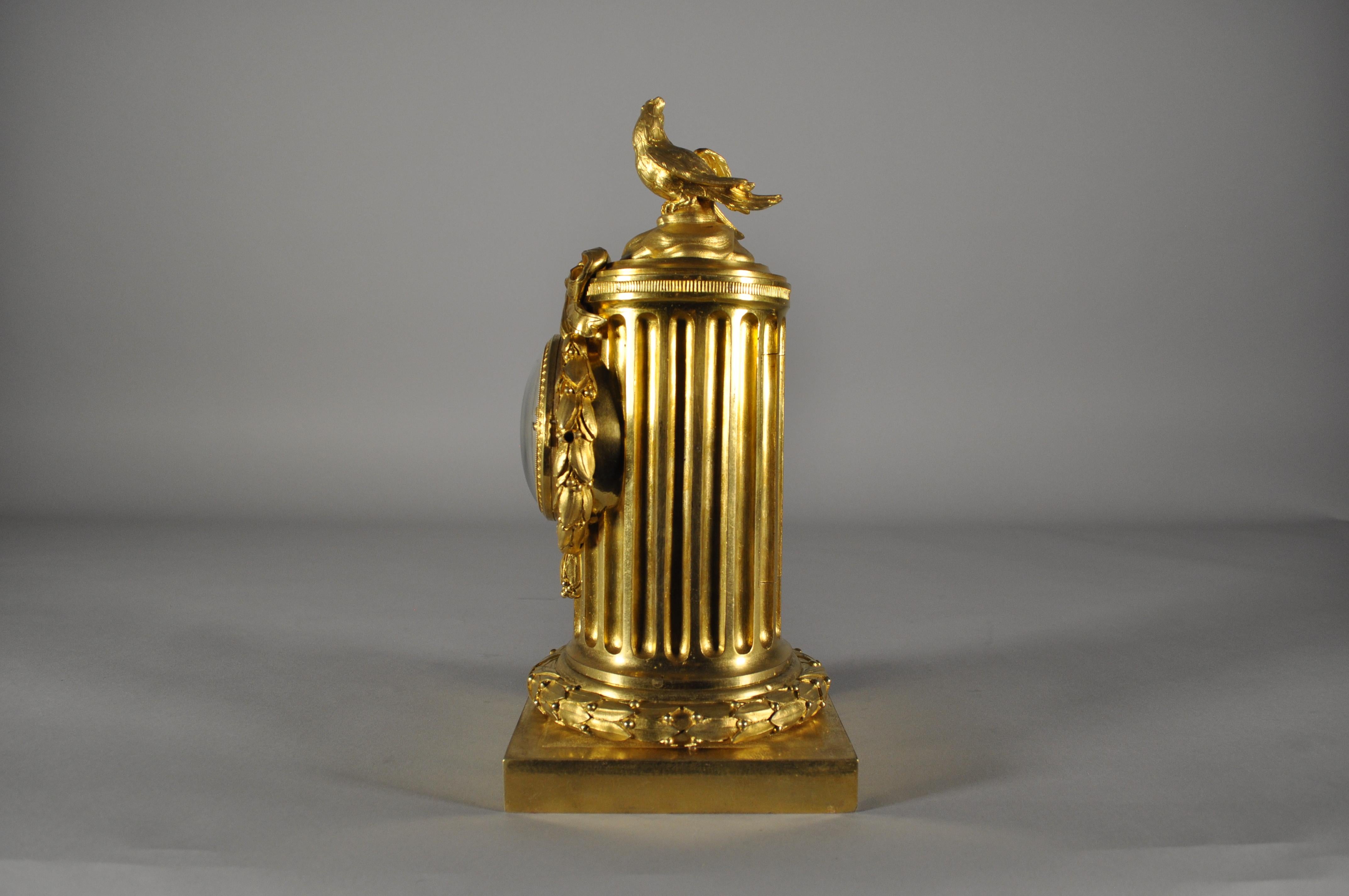 Gilt French Louis XVI table clock , gilt bronze column signed Osmond For Sale