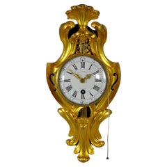 Pendola francese Luigi XV modello cartel d'alcove bronzo dorato. BEECKAERT, 1760