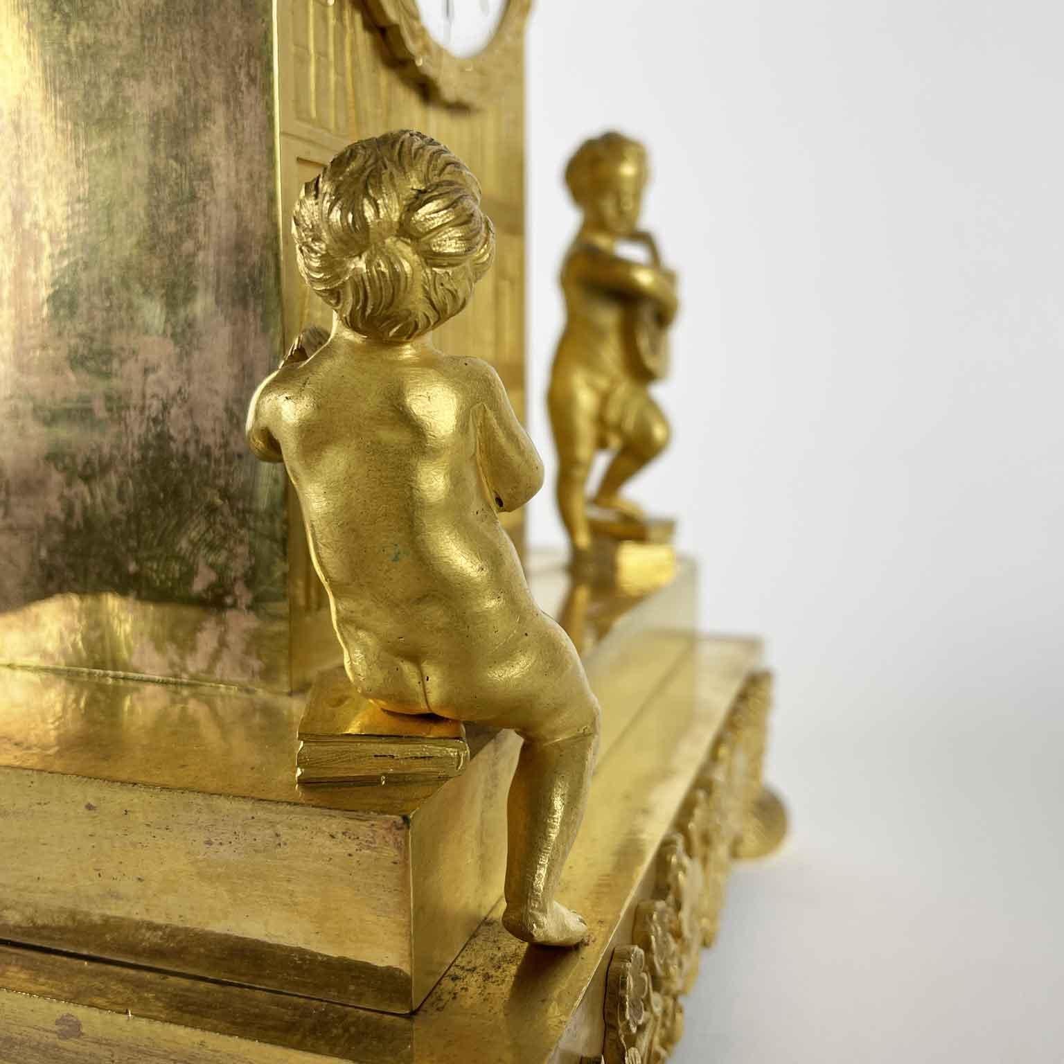 French Empire Pendulum In Gilt Bronze Early 1800s With Putti and Bookcase For Sale 1