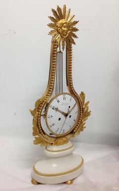 Pendule "lyre oscillante" modèle Louis XVI bronze et marbre