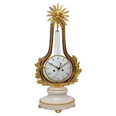 Pendola Luigi XVI modello “lira oscillante”, orologio a pendolo bronzo e marmo