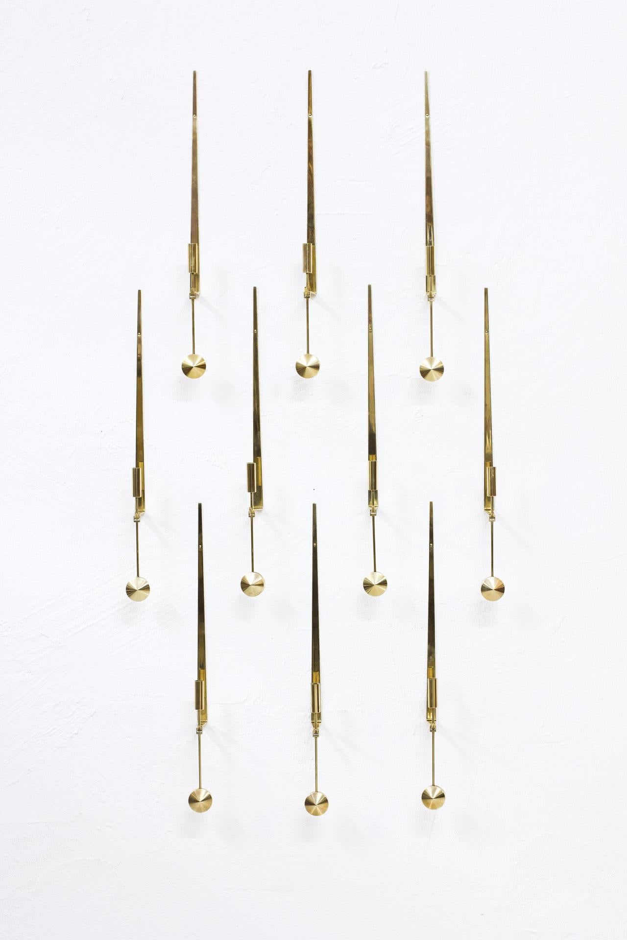 Group of ten wall mounted “Pendulum” candlesticks designed by Pierre Forssell. Manufactured in Sweden by Skultuna during the 1960s. Made from brass. Signed. Very good vintage condition with patina and signs of wear. Price for the set of ten.