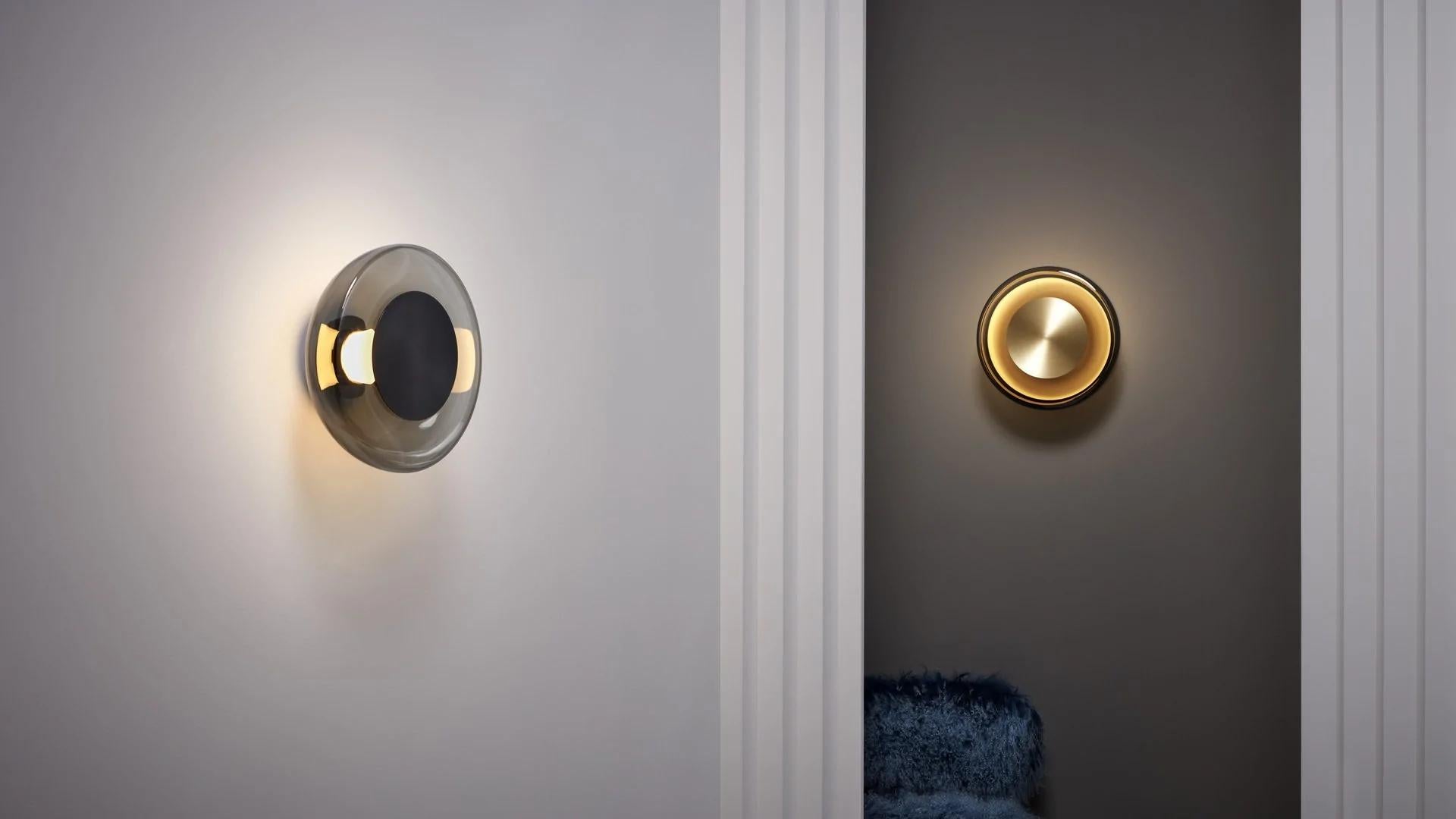 Pendulum wall/ceiling light by CTO Lighting
Materials: satin brass with smoked glass shade.
Also available in bronze with smoked glass shade.
Dimensions: W 32 x D 15 x H 32 cm

All our lamps can be wired according to each country. If sold to