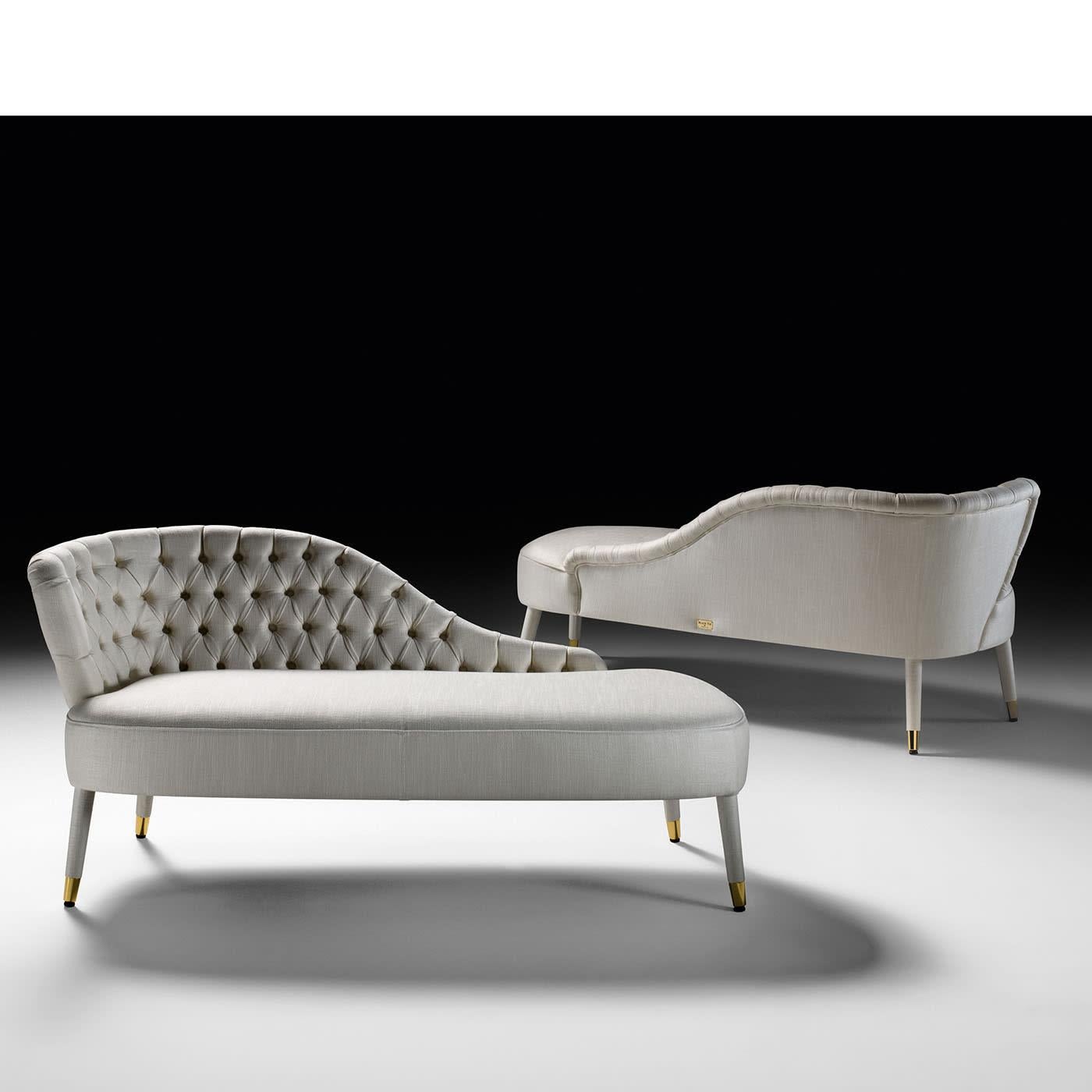 A sinuous wave outlining a backrest marked by a sublime handcrafted design lends this sofa its distinctive seductive asymmetrical look. Brimming with sartorial charm, its beech structure gets complemented by a generously expanded polyurethane