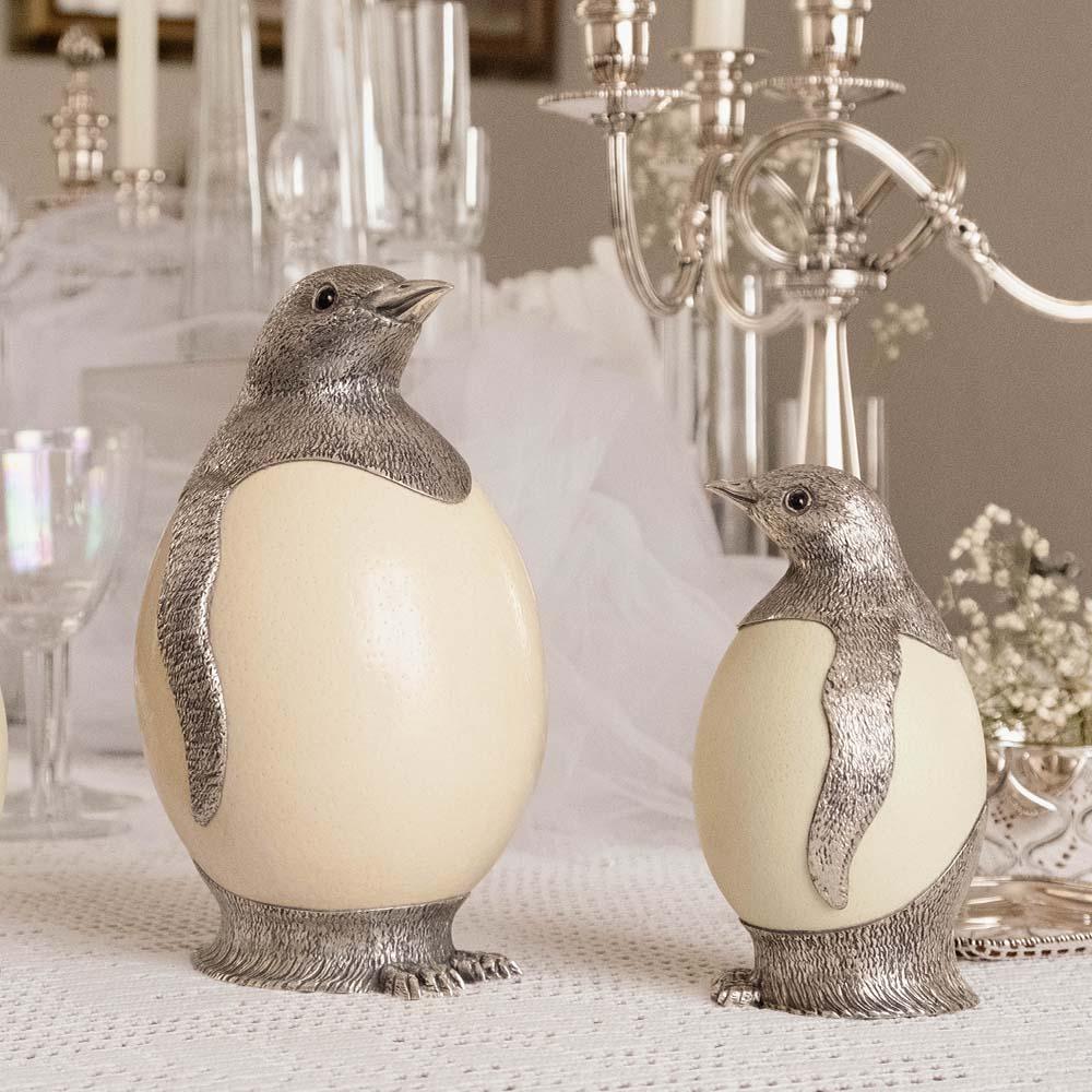 Penguin by Alcino Silversmith 1902 is a handcrafted piece in 925 sterling silver with ostrich egg application and black onix eyes.

This penguin is a contemporary sculpture made of chiseled silver plate applicated to the natural ostrich egg, is