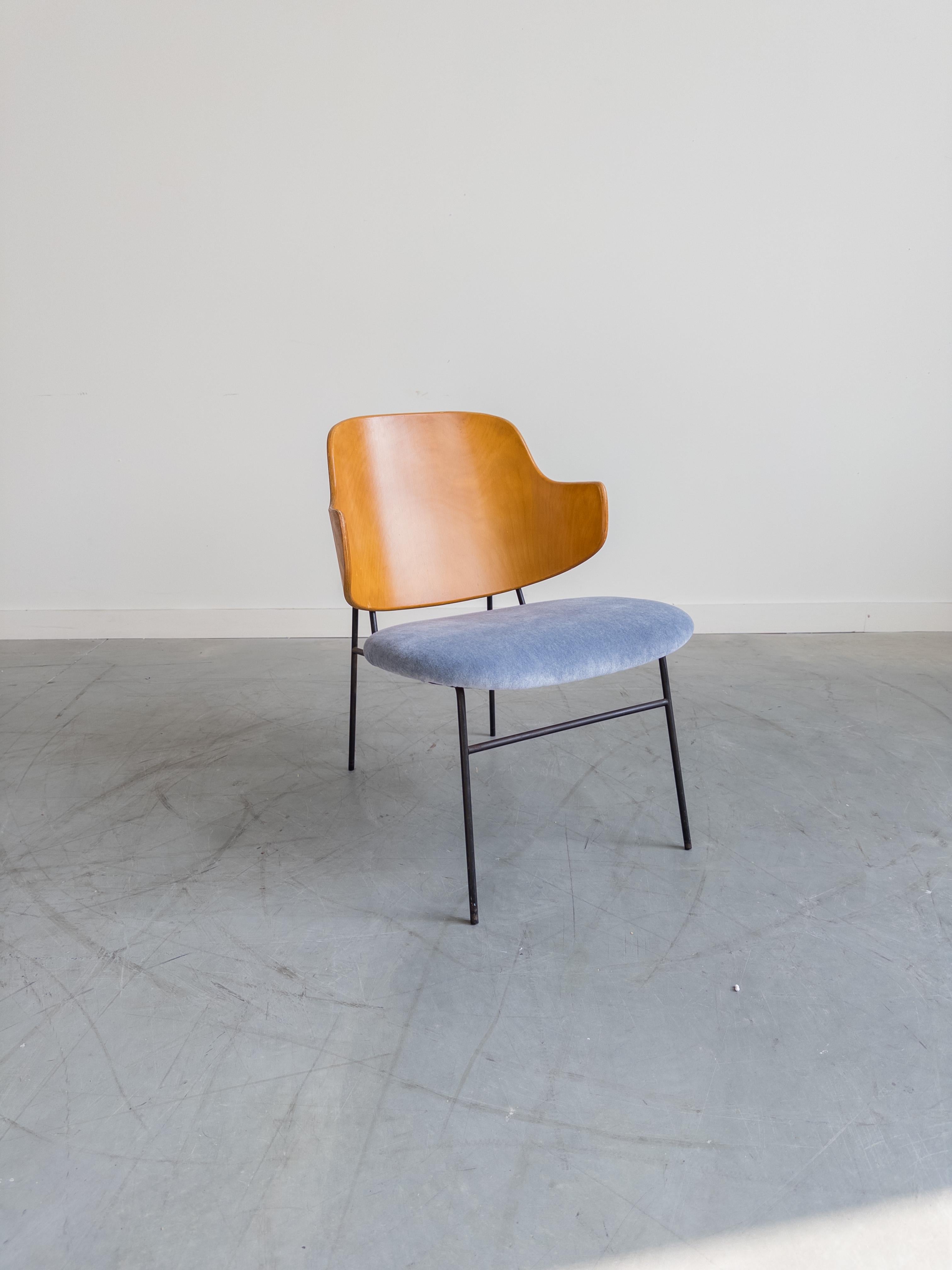 Classic Danish modern Kofod-Larsen penguin chair. Featuring a sturdy black wrought Iron framework with capped feet, slightly slanted and newly upholstered light blue velvet seat with comfortable angled bentwood seat back.
