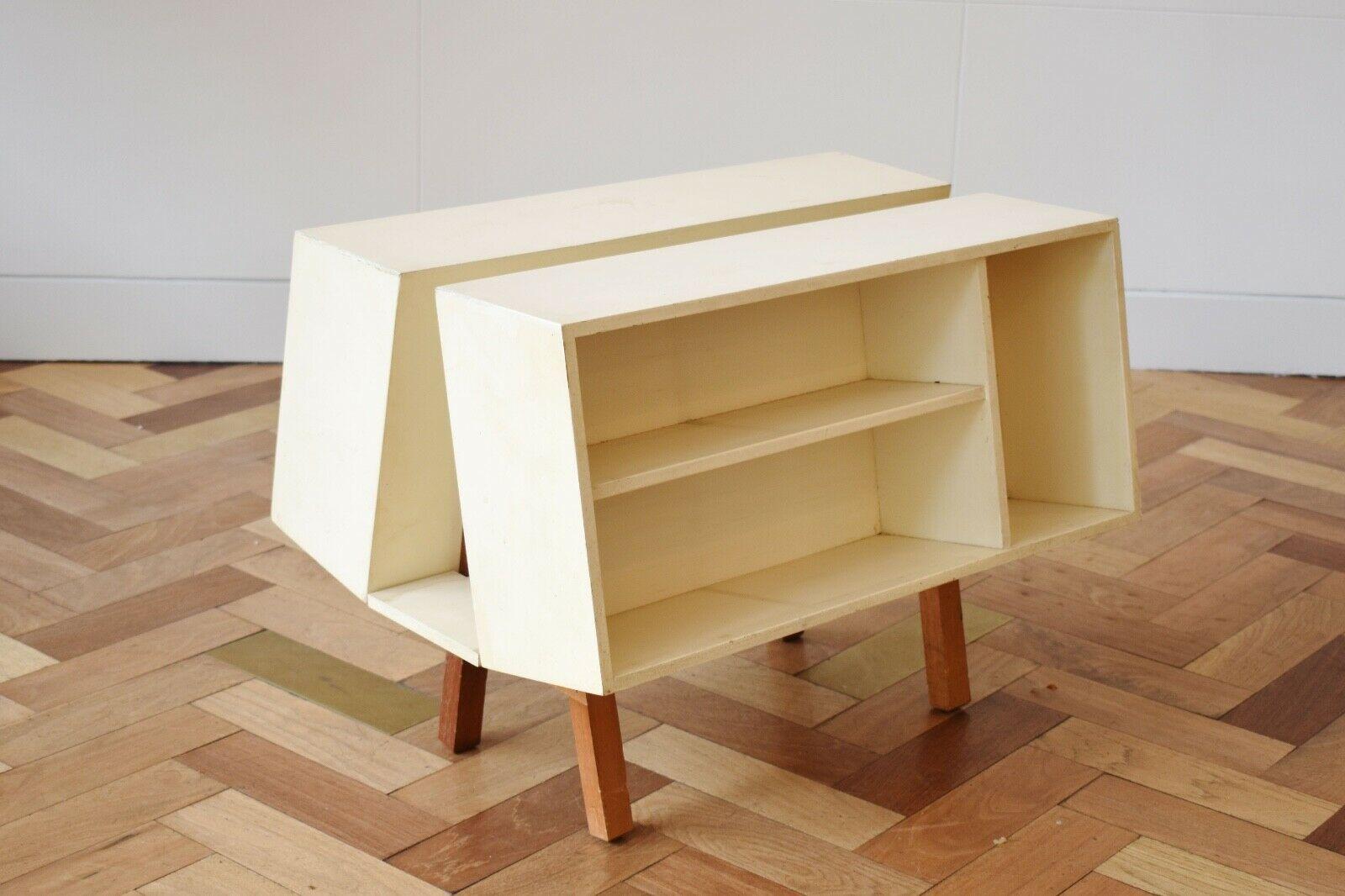Mid 20th Century Penguin Donkey Mark II side table was designed in 1963 by Ernest Race

The piece serves as a multi-functional unit with bookshelf and storage space on both sides, and was manufactured by Isokon.

About the designer:
Ernest Race was