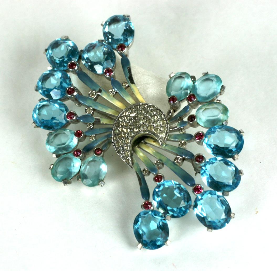 Pennino Aquamarine paste and Enamel Deco Brooch from the late 1930's. Wonderful quality and design depicting a spray of aquamarine pastes with highlights of cream to blue enamel with pale ruby and pave crystal accents accents. 
Superb quality and