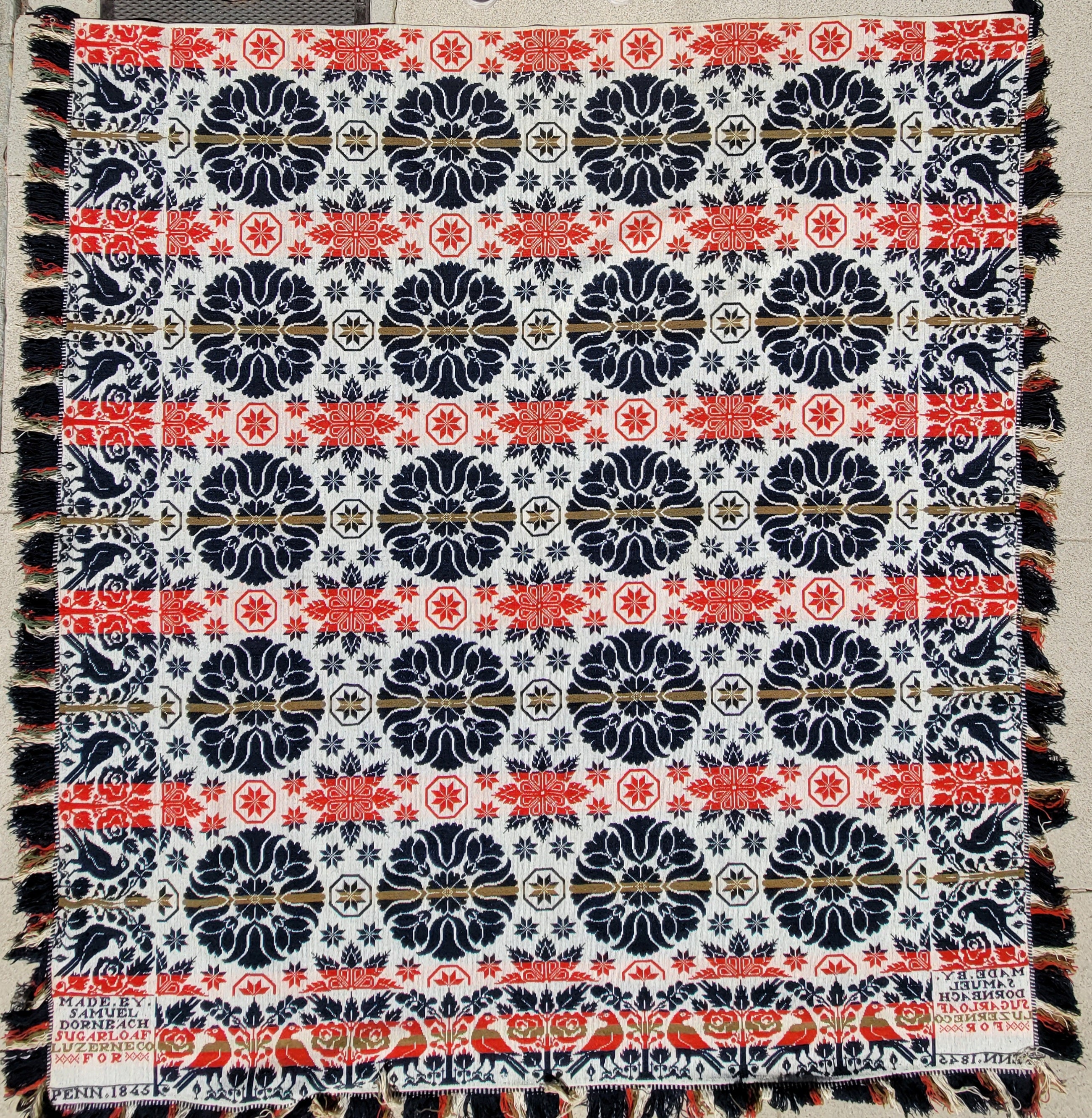 Signed and dated :
Made By Samuel Dornbach Sugarloaf County,Pennsylvania 1845 coverlet hand woven and in fine condition.The fringe is full length and unworn.
