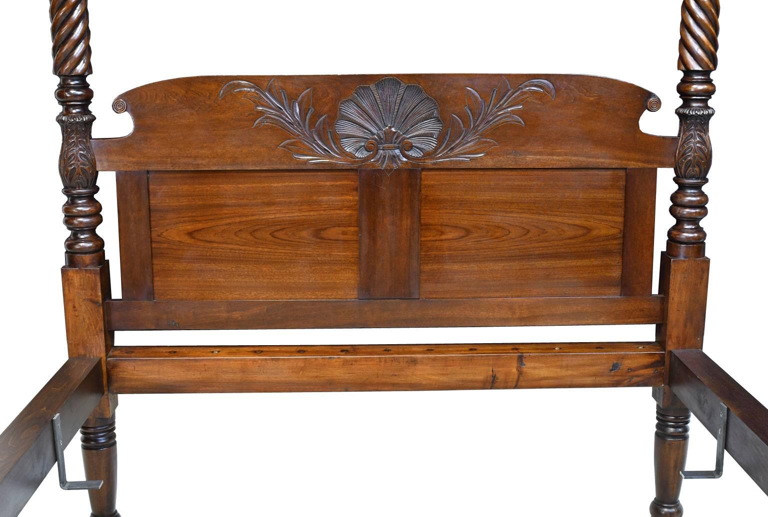 This beautiful four-poster bed from Pennsylvania, circa 1815, with twist-turned posts embellished with acanthus carvings and carved headboard, was adapted to fit a standard queen-size mattress. From a tag still on the bed, it appears the bed was