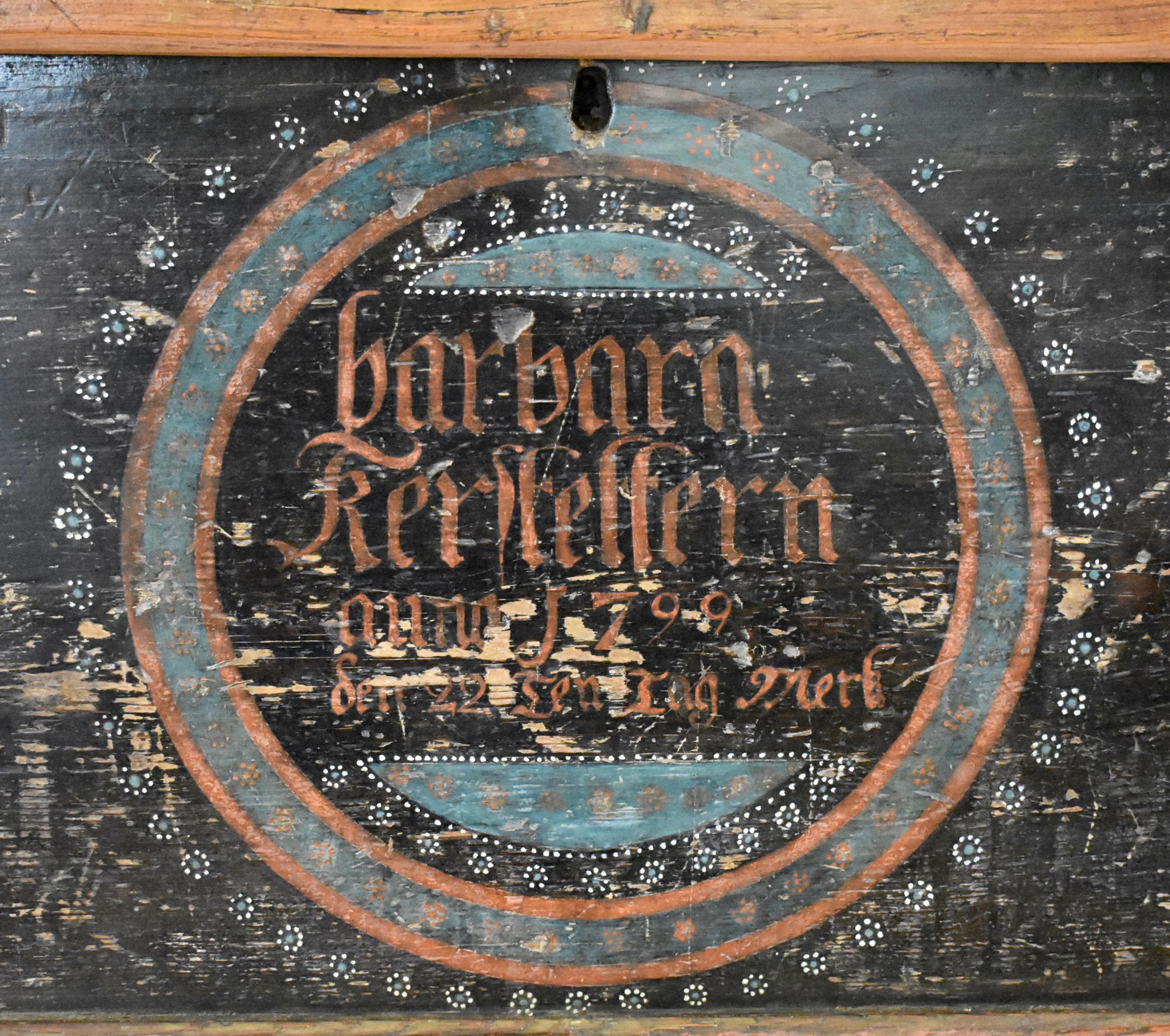 This is a handsome and notable Pennsylvania German painted and decorated dower chest, probably from Northumberland County.
The front of the case has a central medallion, bordered in turquoise and pumpkin paint, enclosing and encircled by delicate