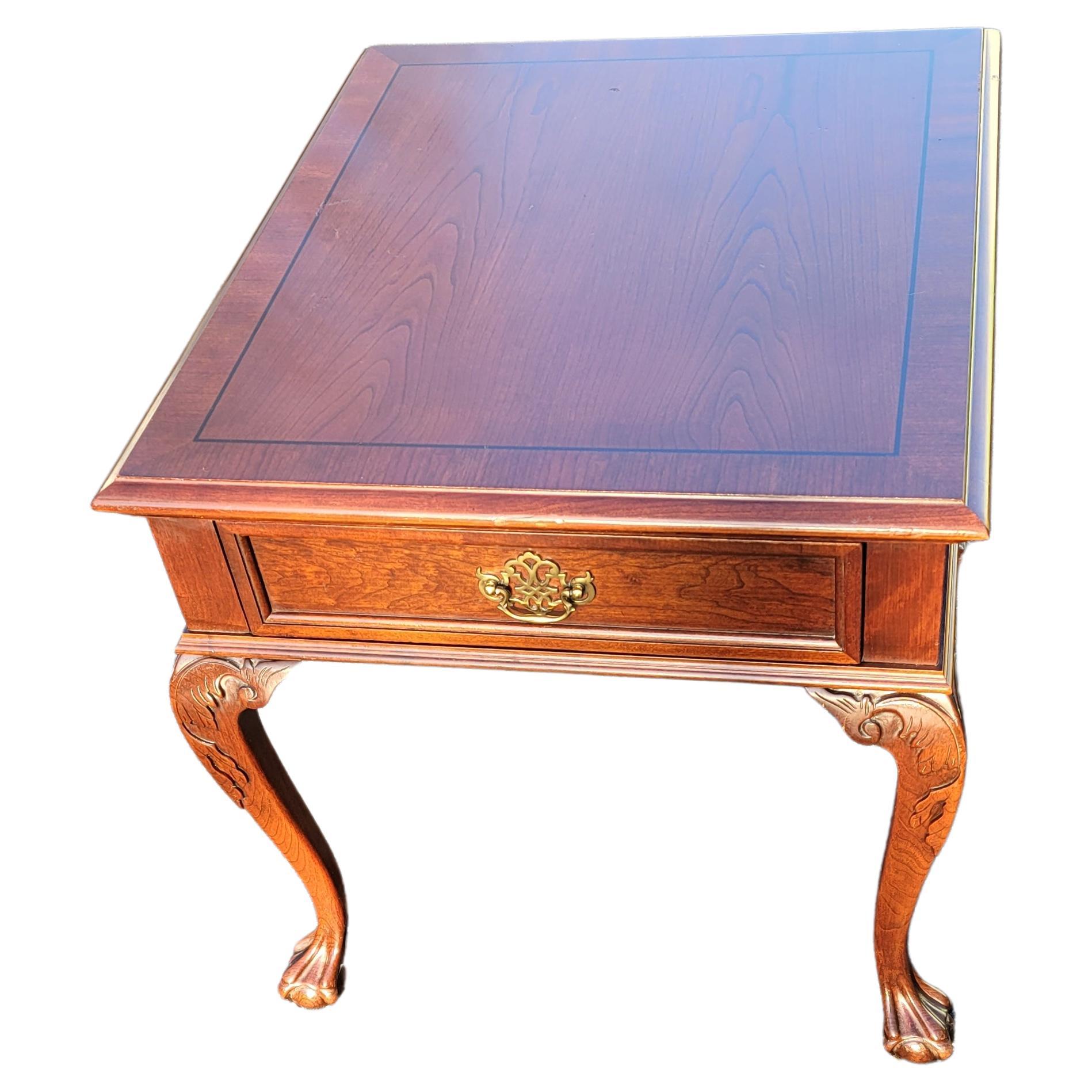 A gorgeous chippendale side table with banded top, carved cabriole legs on Ball & Claw Feet by Pennsylvania House. One drawer with handcut dovetail joints . Measures 24