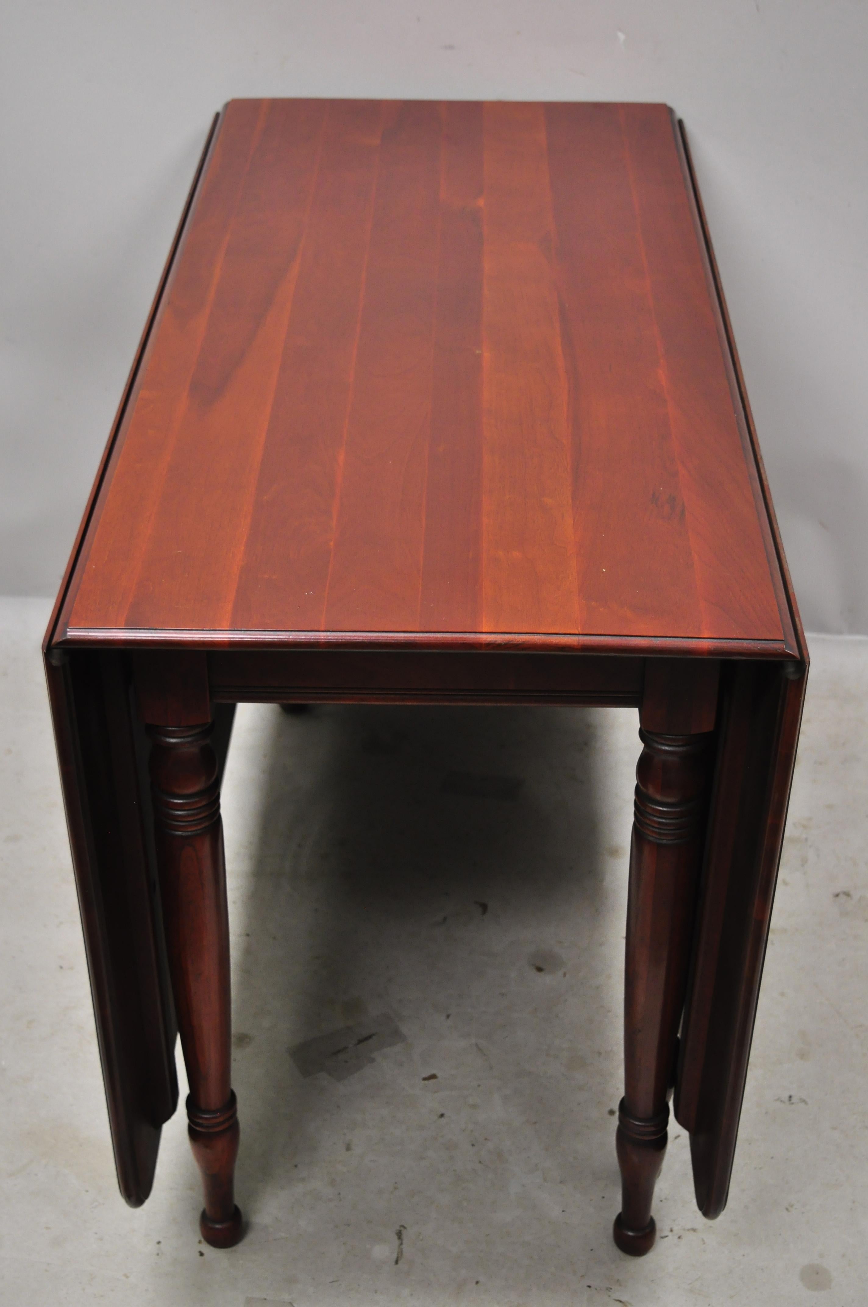 Pennsylvania House Mt. Vernon solid cherrywood vintage drop-leaf dining table. Item features 2 drop-leaf sides, turn carved legs, solid wood construction, beautiful wood grain, original stamp, quality American craftsmanship, great style and form,