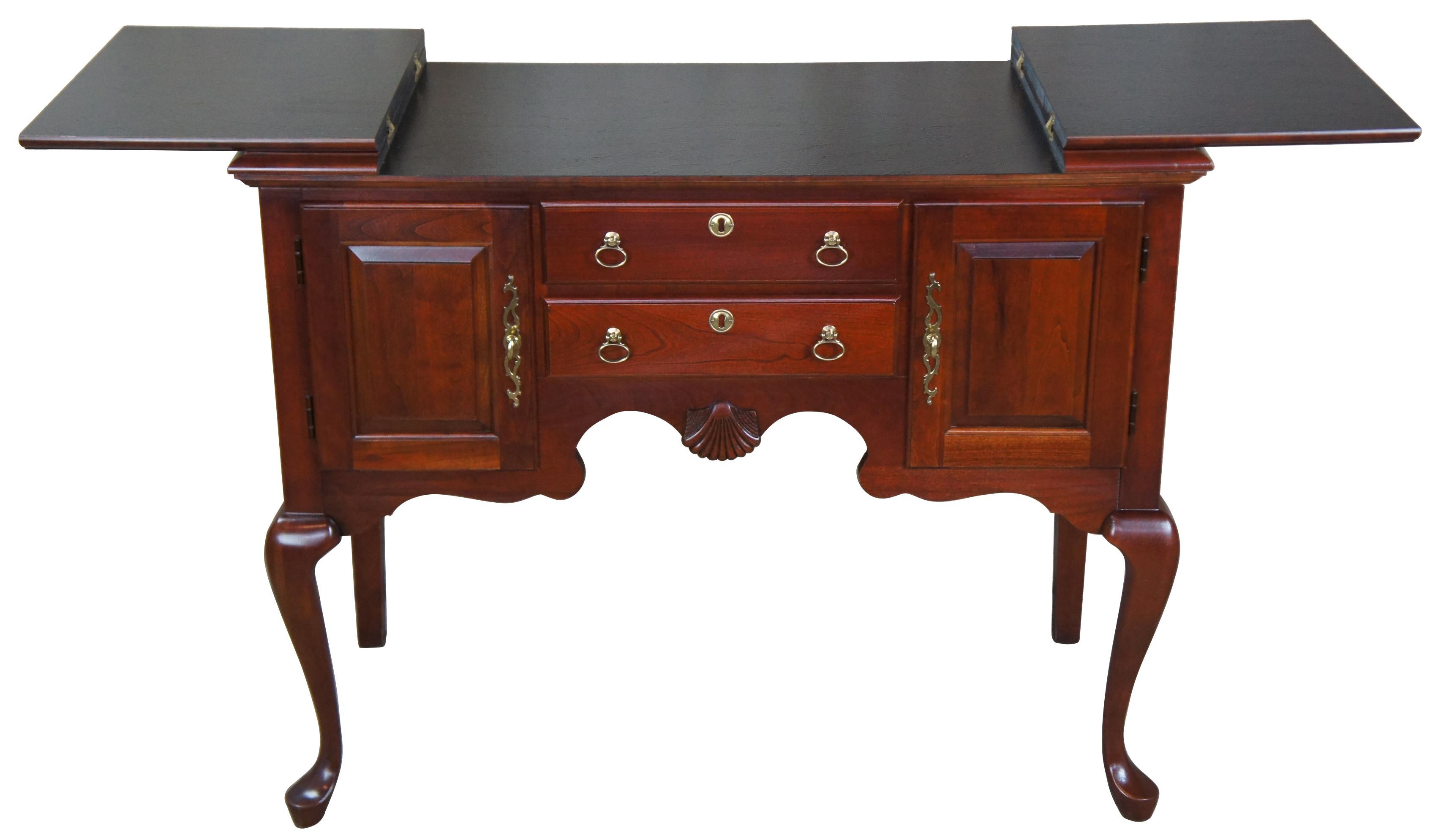Vintage Pennsylvania House flip top cherry buffet or server. Features 18th century design made of solid cherry construction with traditional Queen Anne styling, raised panel cabinet doors with dovetailed drawers, brass hardware, and felt lined