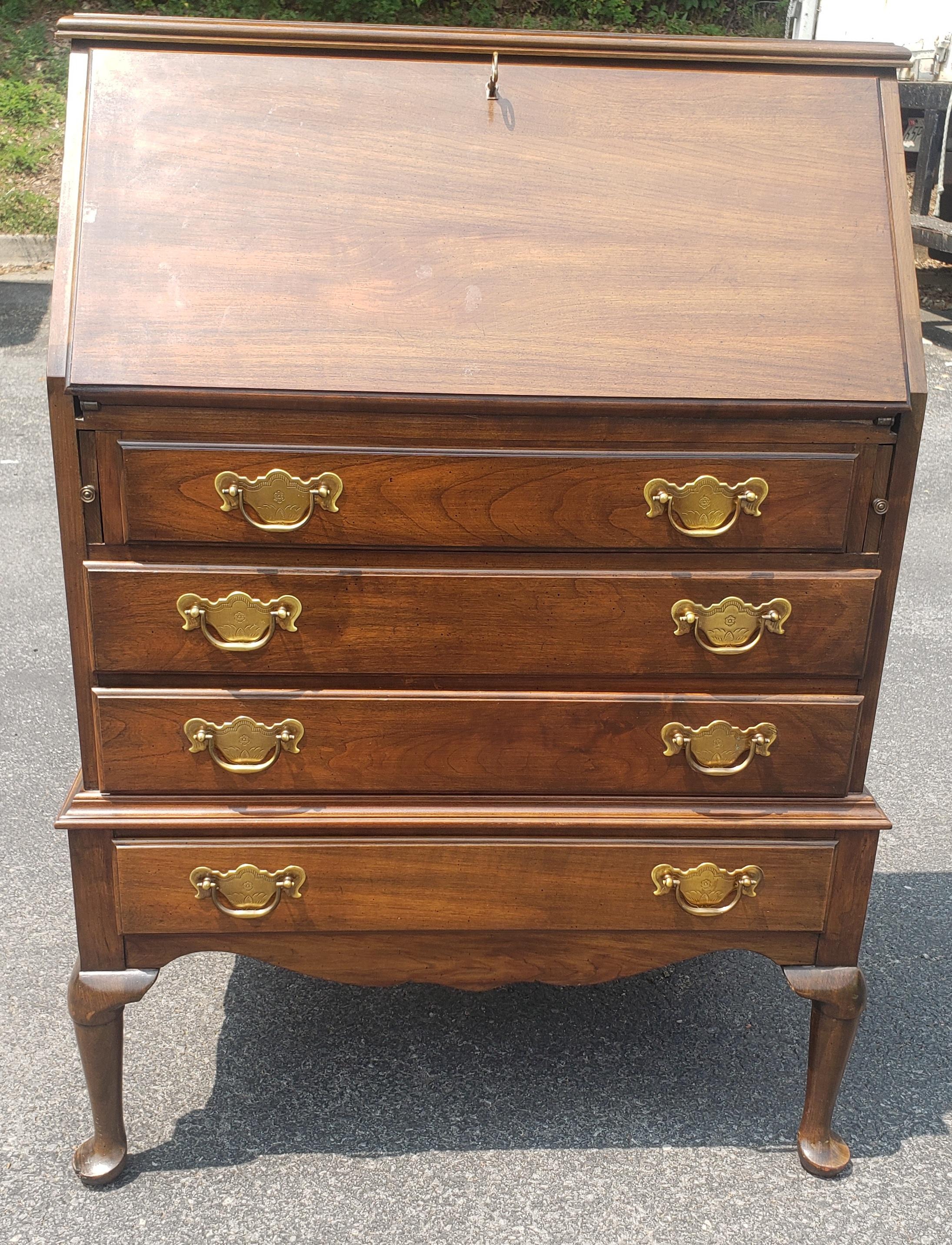 Pennsylvania House Slant Front Cherry Secretary Desk with Lock. Features four fully functional drawers with dovetail construction and Chippendale styles drawer pulls. Functuonal lock with key.. Desk opens with knee clearance of 28.5