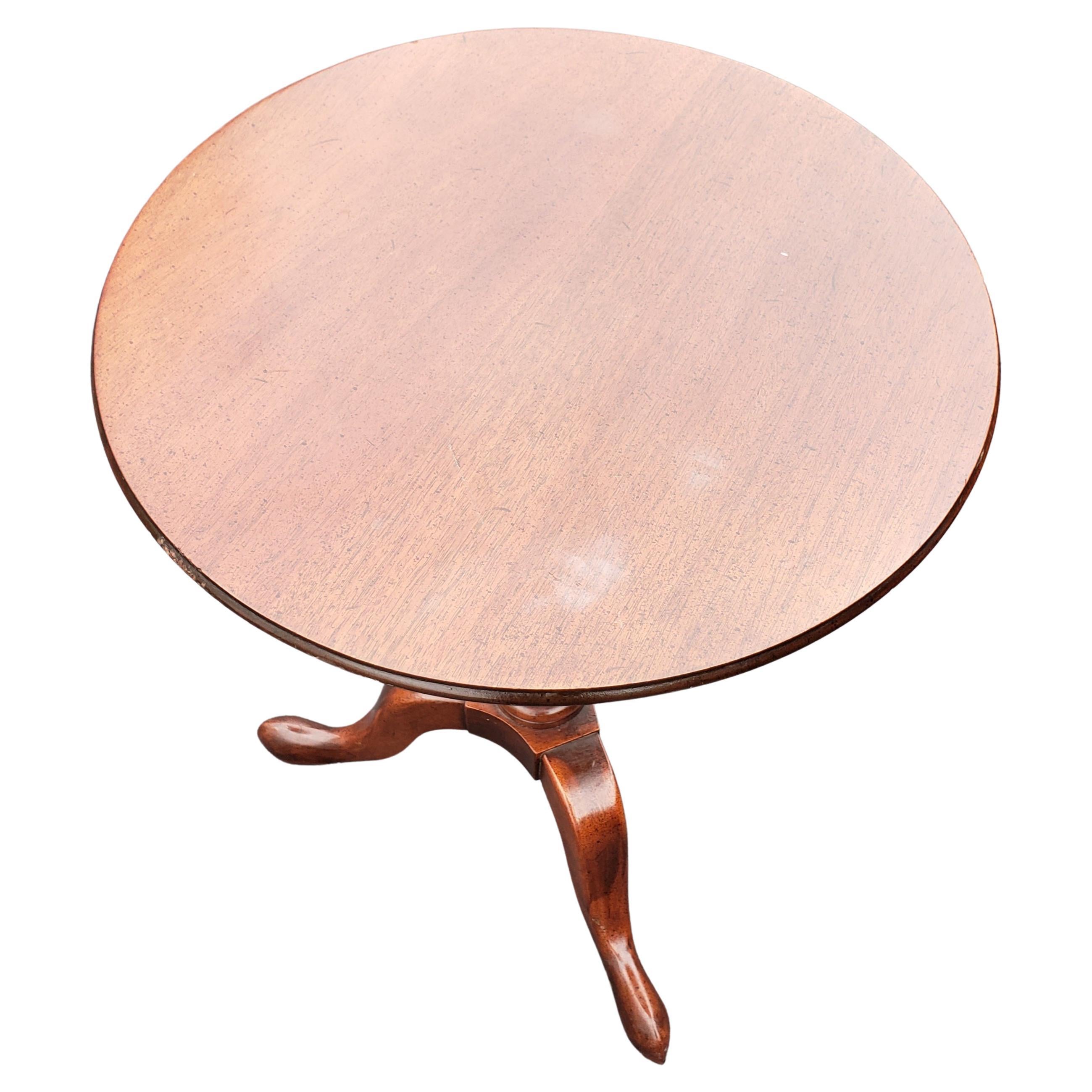 Pennsylvania House solid mahogany occasional tripod side table.
A very good quality Georgian mahogany occasional table Having well figured circular top raised on elegant vase turned central stem terminating on tripod legs And pad feet retaining