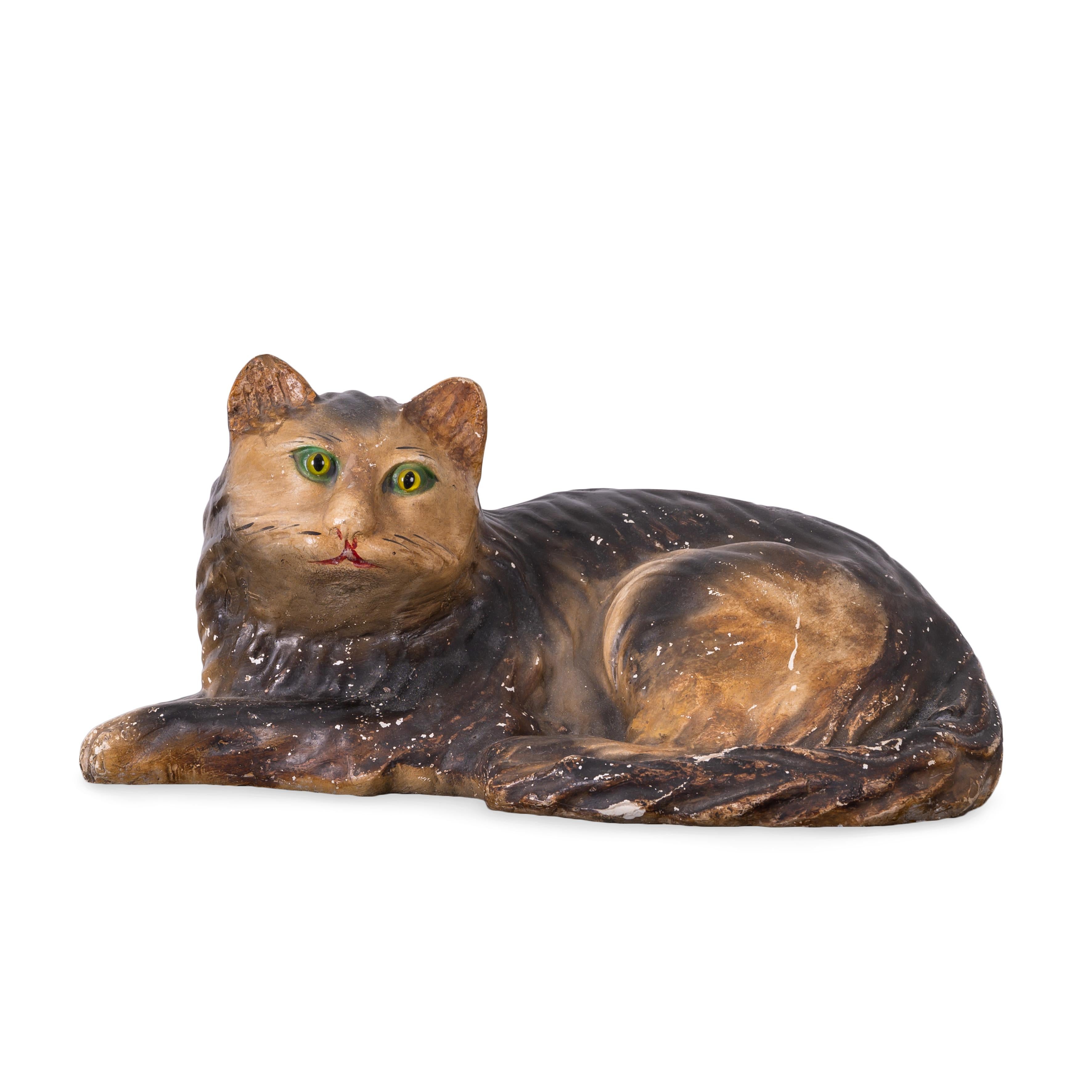 A Pennsylvania painted chalkware cat, circa second half 19th century.

These pieces usually painted by German-American folk artisans from Lancaster to Philadelphia were made to be a more accessible household ornament than expensive Staffordshire