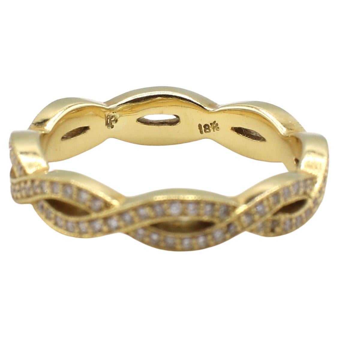 Penny Preville 18 Karat Yellow Gold Twist Natural Diamond Eternity Band Ring 
Metal: 18 Karat Yellow Gold
Weight: 4.26 grams
Diamonds: Approx. .50 CTW G-H VS round natural diamonds
Size: 6.25 (US)
Width: 4mm
Height: 2mm