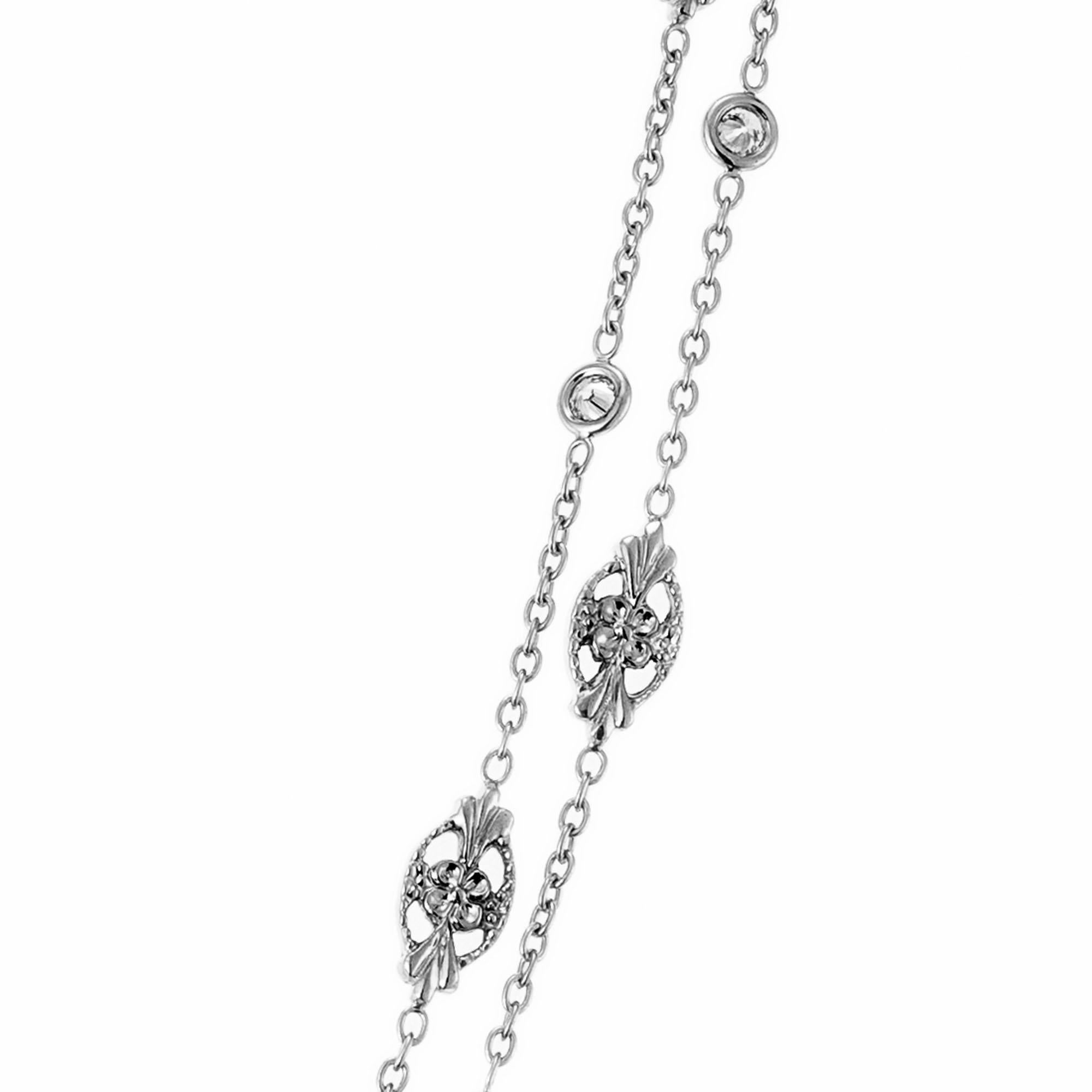 Penny Preville 18k white gold necklace features 16 marquise flower stations alternating with 17 diamond stations. 35 Inches, can be worn long or doubled around neck. Called marquise flower eyeglass necklace by Penny Preville.

17 round brilliant cut