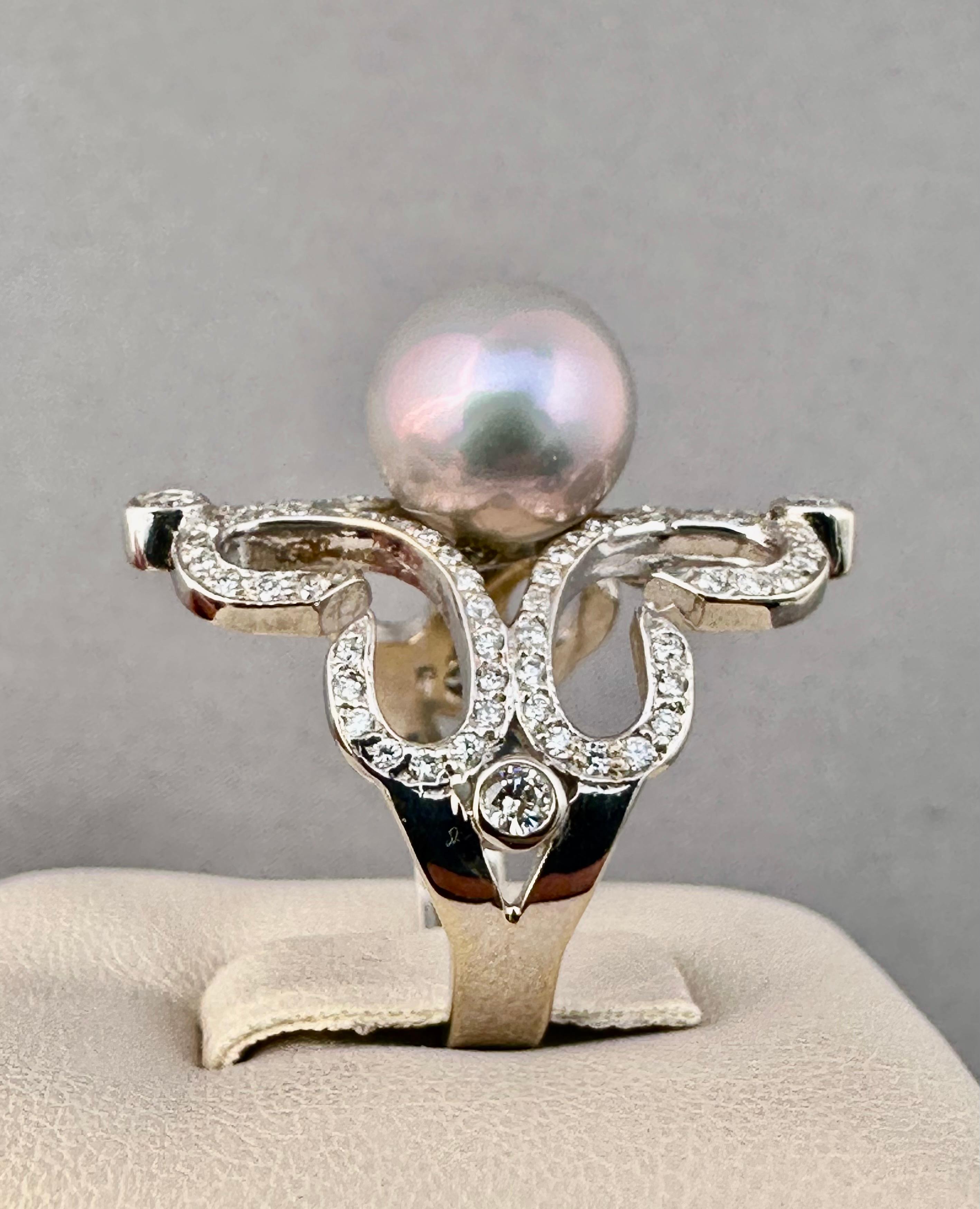 Diamond South Sea Pearl Cocktail Ring White Gold 18K

Diamond weight: 0.94 CT, F, VS1

Grey Pink South Sea Pearl: 10mm

Size:6

Creators Overview:

