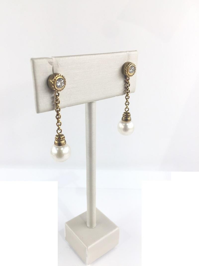 Penny Preville Ladies Pearl and Diamond Earring 
18k Yellow Gold 
Cultured Pearls
Diamond 0.20 Carat Total Weight 
Post Back 
ER870312