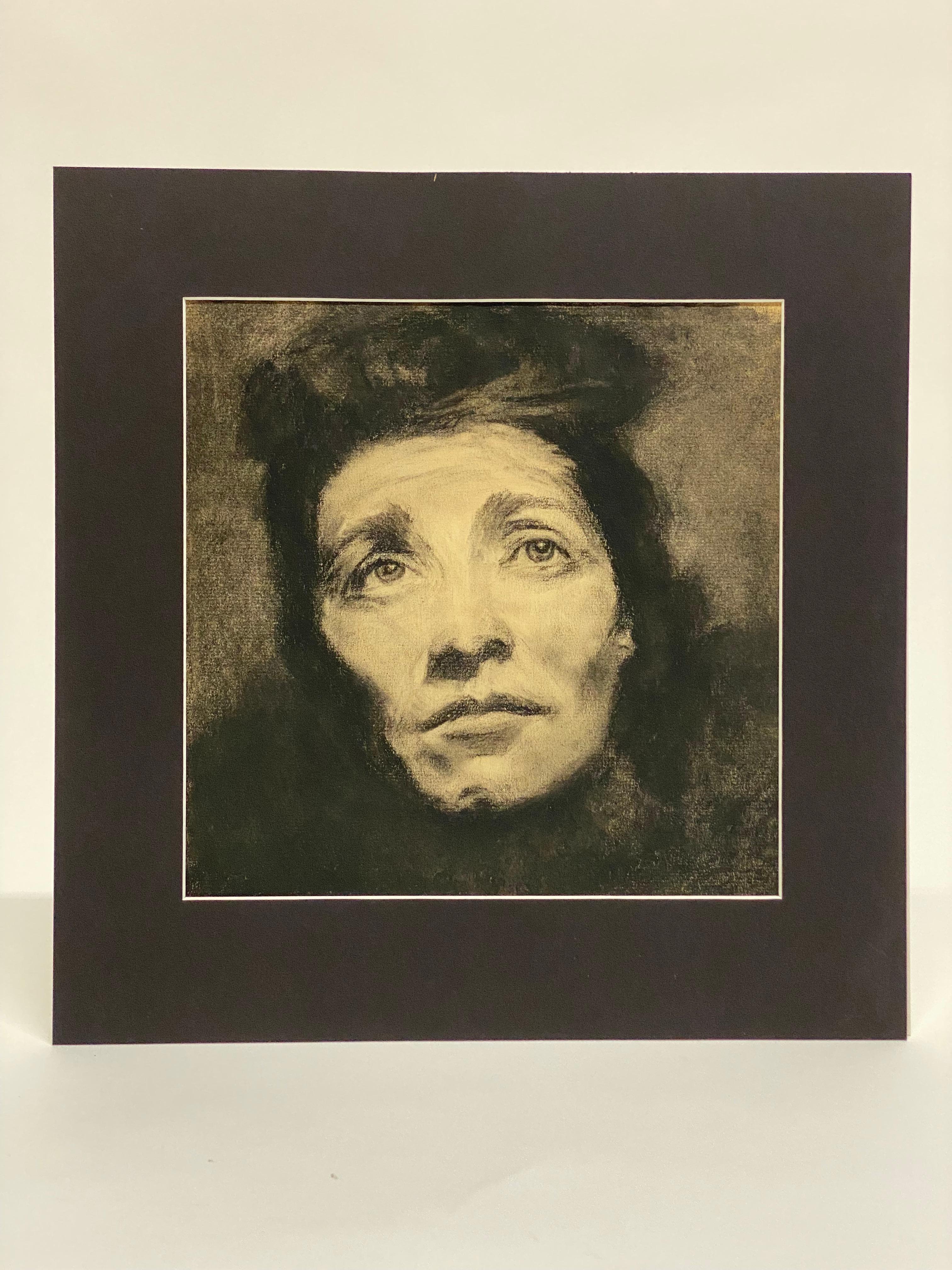 Charcoal drawing on paper female portrait. A deeply expressive portrait of a female subject with an upward gaze. Circa 1920-40. In the manner of the great German artist Kathe Kollwitz. Unsigned. Matted and unframed. Good overall condition with no