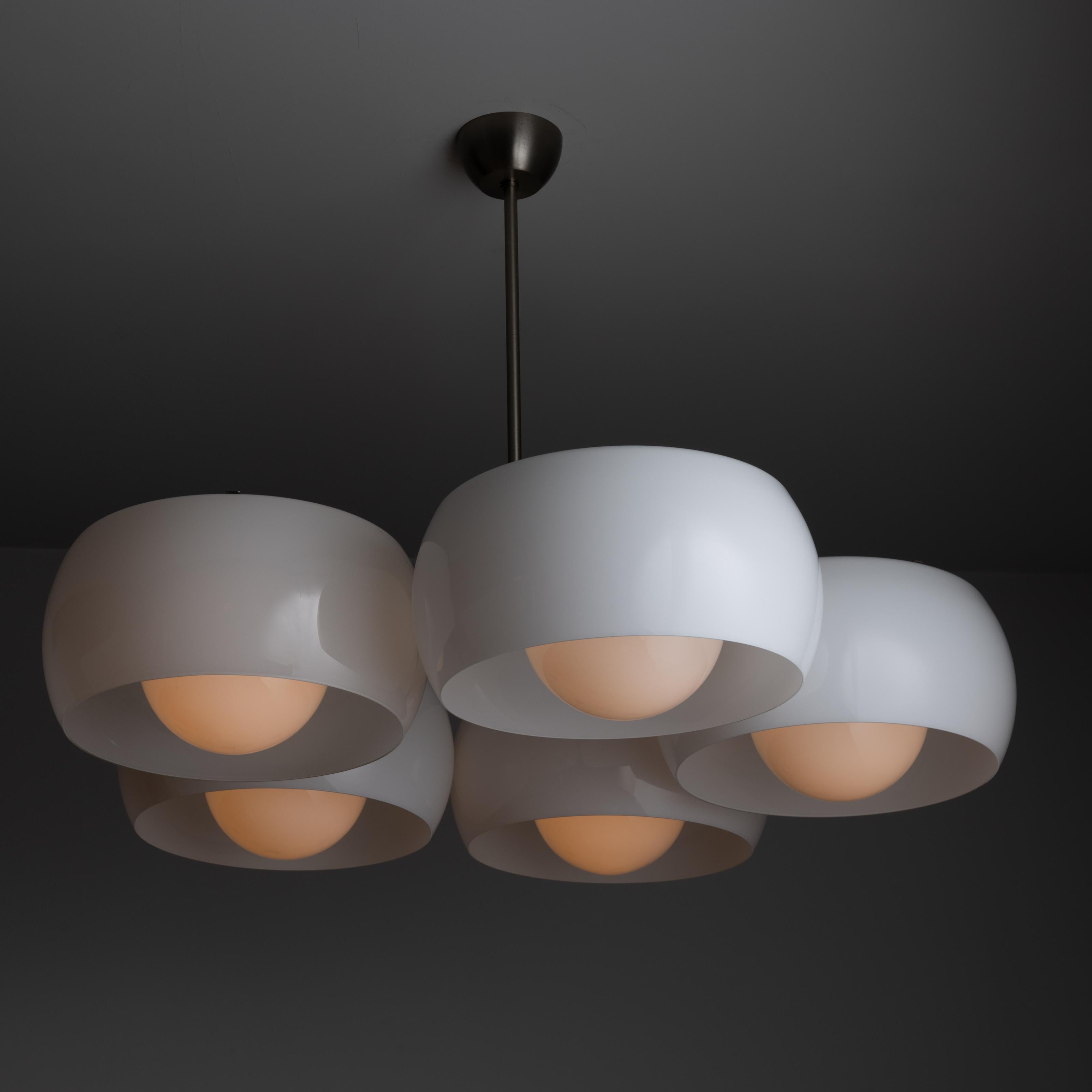 'Pentaclinio' Ceiling lamp by Vico Magistretti for Artemide. Designed and manufactured in Italy, in 1964. Expansive and elegant chandelier with five opaline glass shades and diffusers that provide a soft and beautiful illumination. The chandelier